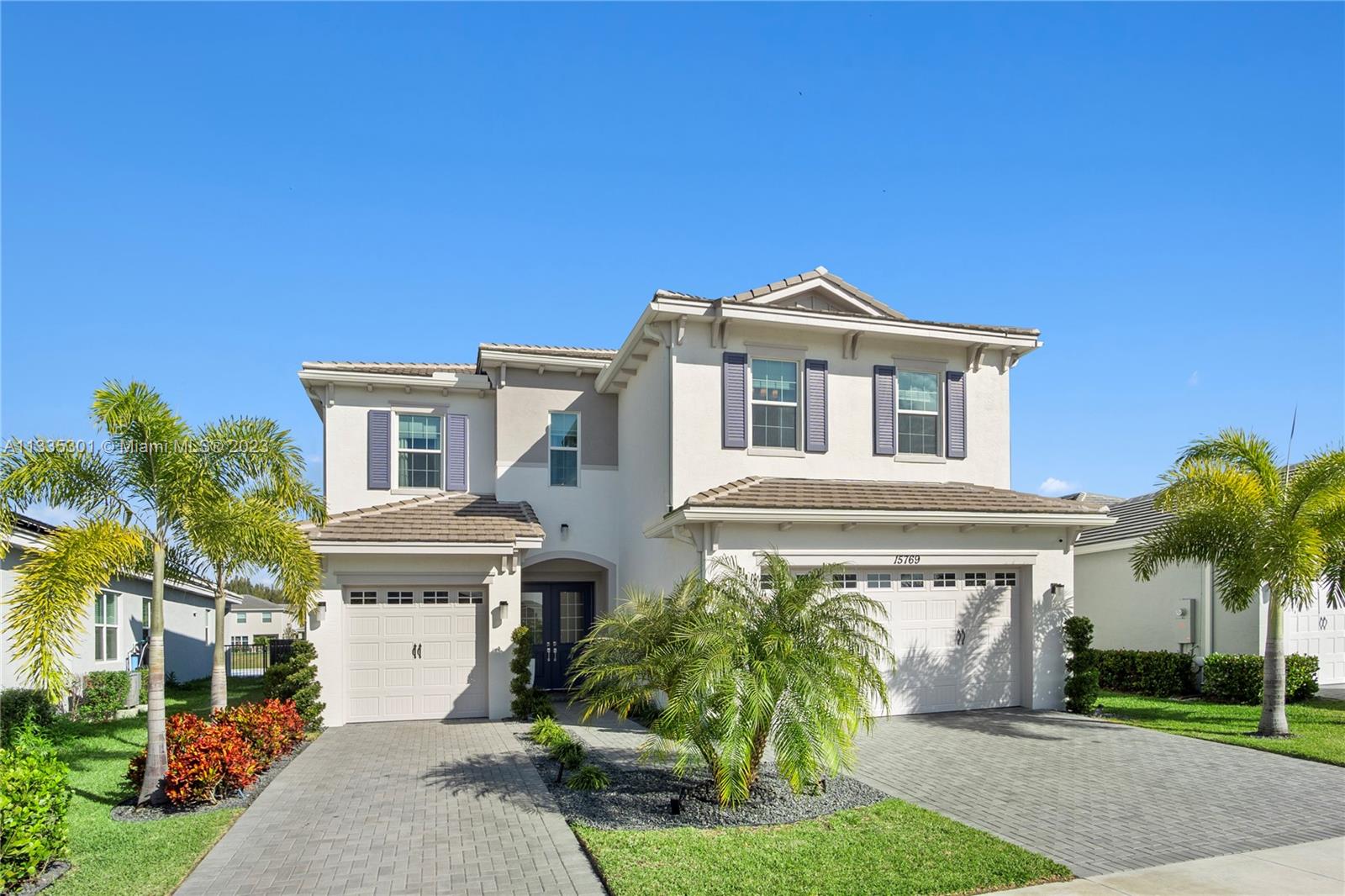 A brand new designer home in Westlake, Florida, this stunning Poinciana floorplan with spacious four bedrooms and three and a half bathrooms, is a modern and luxurious property. The house is elegantly fully furnished and has a stunning lake view, providing a peaceful and serene environment. It features a built-out patio with a jacuzzi, perfect for outdoor relaxation and entertainment. For the chef of the house, find a two-wall oven, oversized refrigerator, microwave, alkaline water system along with water filtration system for the entire home and much more. The combination of scenic views and comfortable furnishings make this house an ideal choice for those seeking a luxurious living experience or an investor ready for a turn key property to lease to future tenants.