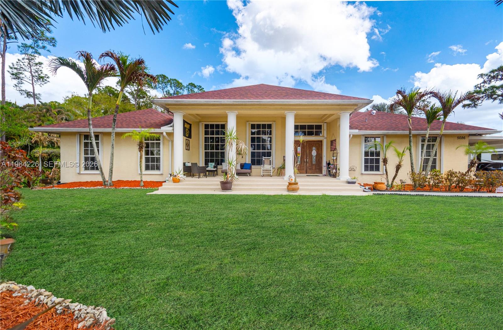 Discover refined country living in this 5-bedroom 3.5-bath estate nestled on 1.43 acres in the highly desirable Acreage of West Palm Beach. Surrounded by lush greenery and a curated collection of mature fruit  and nut trees , this property offers both privacy and natural beauty, Thoughtfully designed for comfort and entertaining, the residence features a spacious layout and newer roof, whole house generator enabling to enjoy all creature comforts in any situation. Step outside to your private resort-style retreat-complete with a sparkling pool and outdoor bar, perfect for hosting under the Florida sun. A two car garage and expansive grounds provide ample space for recreational vehicles, boats, of future enhancements. This is a rare opportunity to enjoy elevated living with room the breathe, all just minutes from the beat of West Palm Beach.
  
  Experience luxury, space, and serenity-your private estate awaits.