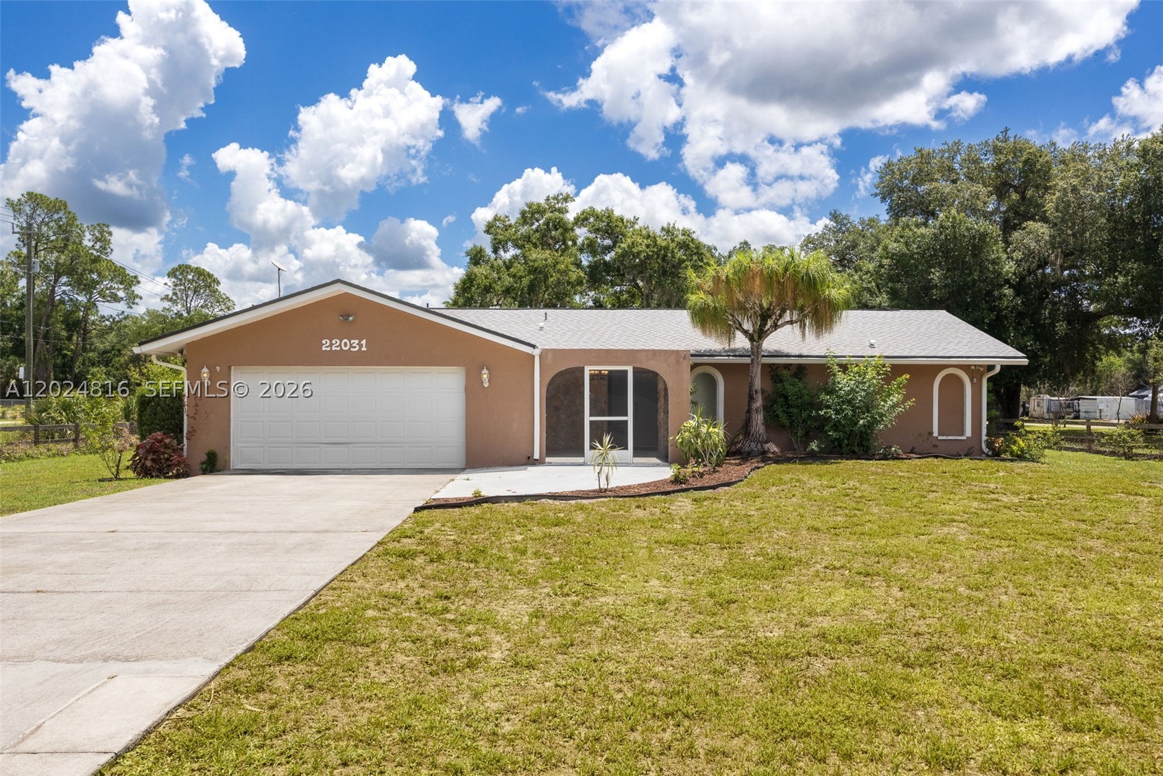 Nestled on a beautifully landscaped 1+ acre corner lot in charming Alva, this inviting pool home offers a private, gated retreat with easy access to S.R. 80 for effortless commutes to Fort Myers and LaBelle. Lush landscaping and mature fruit trees create a serene setting, while inside, a welcoming foyer opens to a spacious family room with sliding glass doors leading to the screened pool lanai—perfect for entertaining and enjoying Florida living. The split-bedroom layout provides privacy, and the open kitchen features an R/O water system for added convenience. Outdoor living shines with a large 15' x 30' pool, ample space to relax, and beautifully maintained grounds. Recent updates include a newer roof (2022), HVAC system (2021), and hot water heater (2024), along with tile and laminate flooring, upgraded lighting, and ceiling fans throughout. Located outside a flood zone for added peace of mind, the property also includes a large detached building with electric and water, plus an additional concrete slab for extra storage, equipment, or customization. Don’t miss this beautifully maintained Alva home where privacy, space, and natural beauty come together—schedule your private showing today!