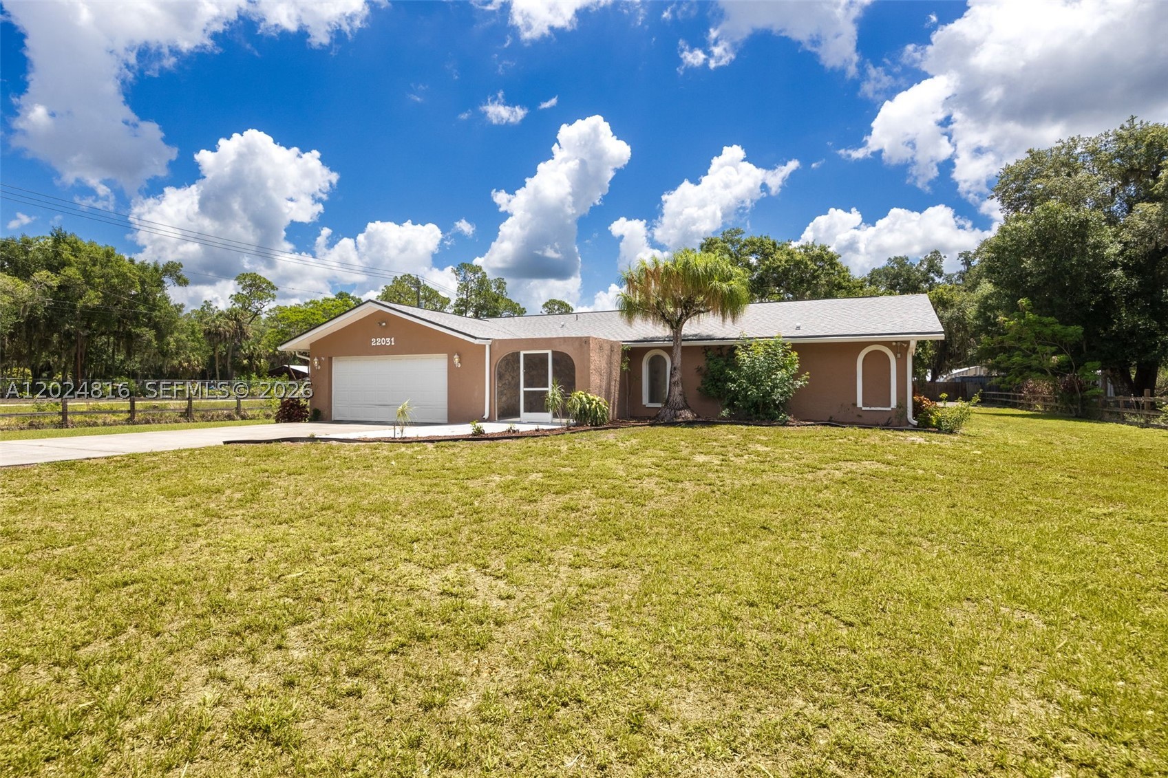 Nestled on a beautifully landscaped 1+ acre corner lot in charming Alva, this inviting pool home offers a private, gated retreat with easy access to S.R. 80 for effortless commutes to Fort Myers and LaBelle. Lush landscaping and mature fruit trees create a serene setting, while inside, a welcoming foyer opens to a spacious family room with sliding glass doors leading to the screened pool lanai—perfect for entertaining and enjoying Florida living. The split-bedroom layout provides privacy, and the open kitchen features an R/O water system for added convenience. Outdoor living shines with a large 15' x 30' pool, ample space to relax, and beautifully maintained grounds. Recent updates include a newer roof (2022), HVAC system (2021), and hot water heater (2024), along with tile and laminate flooring, upgraded lighting, and ceiling fans throughout. Located outside a flood zone for added peace of mind, the property also includes a large detached building with electric and water, plus an additional concrete slab for extra storage, equipment, or customization. Don’t miss this beautifully maintained Alva home where privacy, space, and natural beauty come together—schedule your private showing today!
