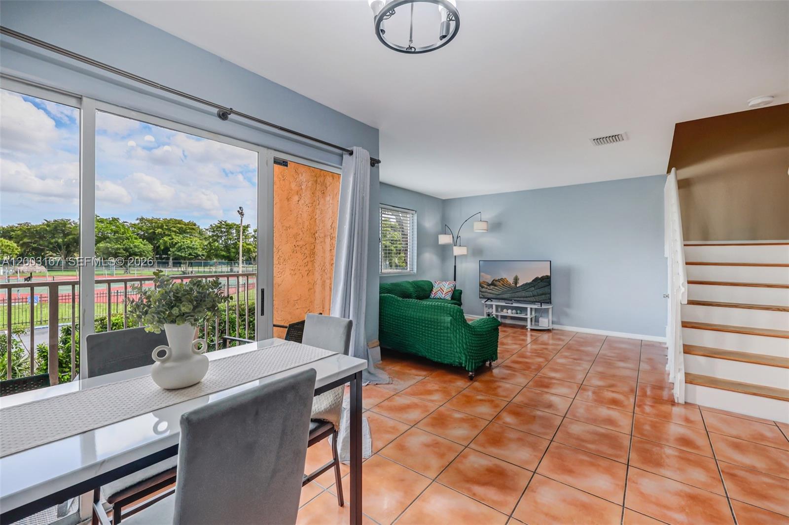 3bed/2.5bth - Step into this beautifully maintained second-floor condo, with a perfect blend of tile and laminate wood flooring throughout, the home radiates warmth and style. Enjoy an open balcony overlooking the park, perfect for relaxing evenings. Convenience is key with an in-unit washer and dryer, plus two assigned parking spaces. This inviting condo is ready to become your next home! Investor-friendly—rents ~up to $2,800/month. **CASH OFFERS ONLY** See Photos with Floor Plan and 3D Tour available
