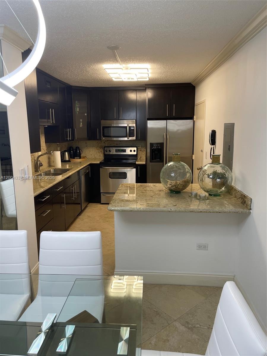 Located on Millionaire's Row in Miami Beach, in an elegant building designed by the renowned architect Morris Lapidus. This beautifully furnished two-bedroom, two-bathroom apartment has everything you could ever dream of. Enjoy resort-style living in a building featuring every amenity. Price drastic reduced for a quick sale. Owner motivated.