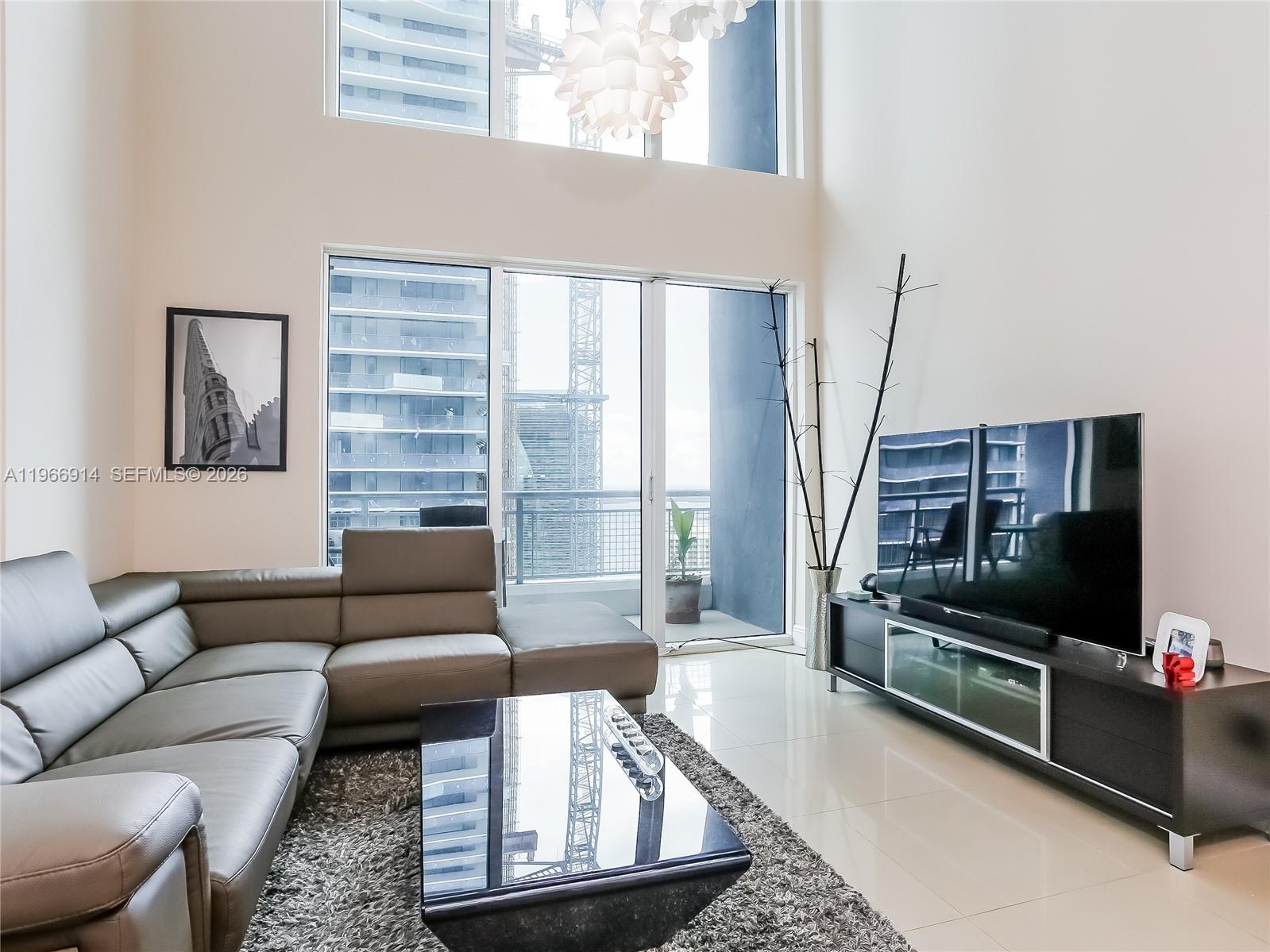 Spectacular two-story 2BR/2.5BA flow-through unit on the 34th floor featuring double-height ceilings in the living room and abundant natural light. Enjoy sunrise and sunset from two balconies (east & west) showcasing breathtaking views of the Bay, Brickell skyline, South Beach, and Coconut Grove. The unit offers stainless steel appliances, granite countertops, and marble flooring throughout. Full-service building with resort-style amenities. Ideally located within walking distance to Brickell’s top restaurants, shopping, and entertainment.