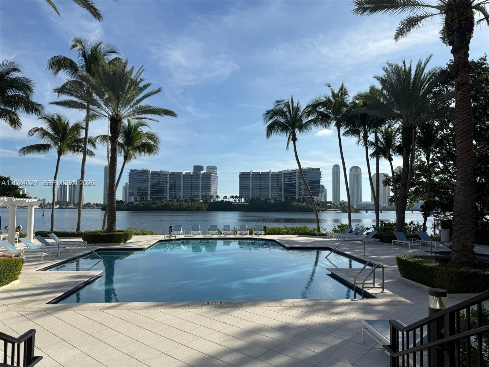 Beautifully upgraded 3 bed / 2 bath condo in the highly desiderable neighborhood Village by the Bay. Unit also has a fully enclosed office. Remodeled & tastefully done bathrooms, kitchen, coffee bar. All bedroom closets have been customized with built in units. Enjoy the conviniece of a first floor entry where you can walk outside to enjoy canal views and dont have to deal with stairs or elevators. Village by the Bay is a family pet friendly community with expansive green space, 2 pools, 2 barbeque grills, a tennis court, gym , party room, dog park. Conveniently located next door to Veterans Park and walking distance to many shops, restaurants and parks.