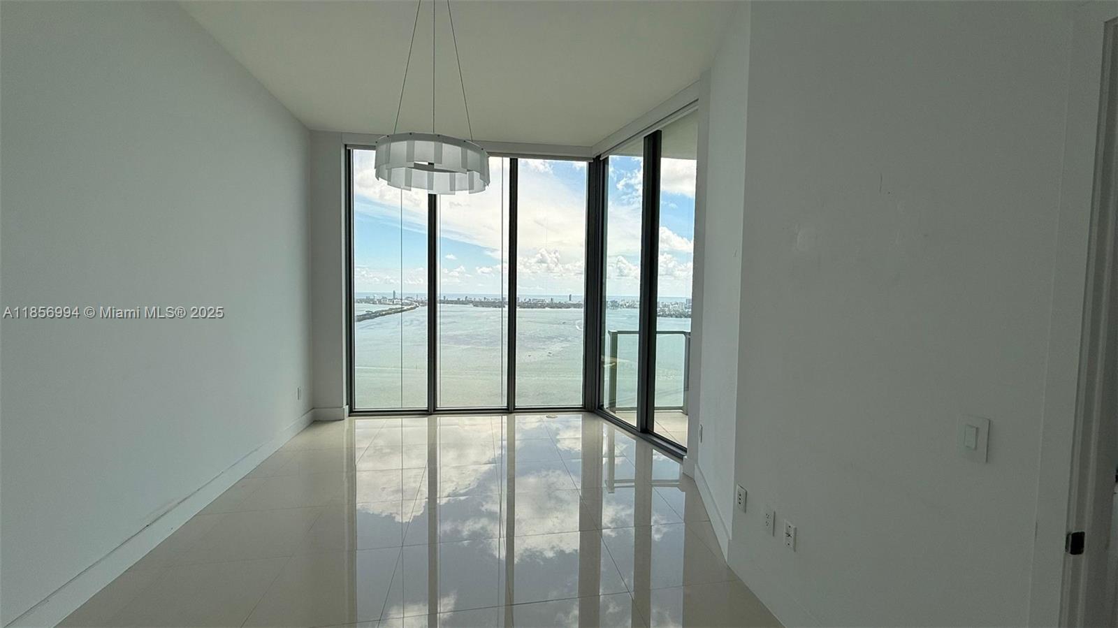 MIAMI LIVING! Enjoy the LOWER PENTHOUSE with extra high ceilings in this luxurious building. This spacious 2 bedroom + DEN and 3 bathroom boasts a private elevator that opens directly to your unit. Amazing water views from all rooms! Enjoy finished walk-in closets, gorgeous installed flooring, top of the line appliances, electric blackout shades.  This unit was designed and finished by top interior designer.  Biscayne Beach goes beyond the standard of luxury- 2 pools, cabanas, beach club with private beach for the building, state of the art gym, spa, tennis courts, dog park, and 24 hour concierge. Available for immediate occupancy!