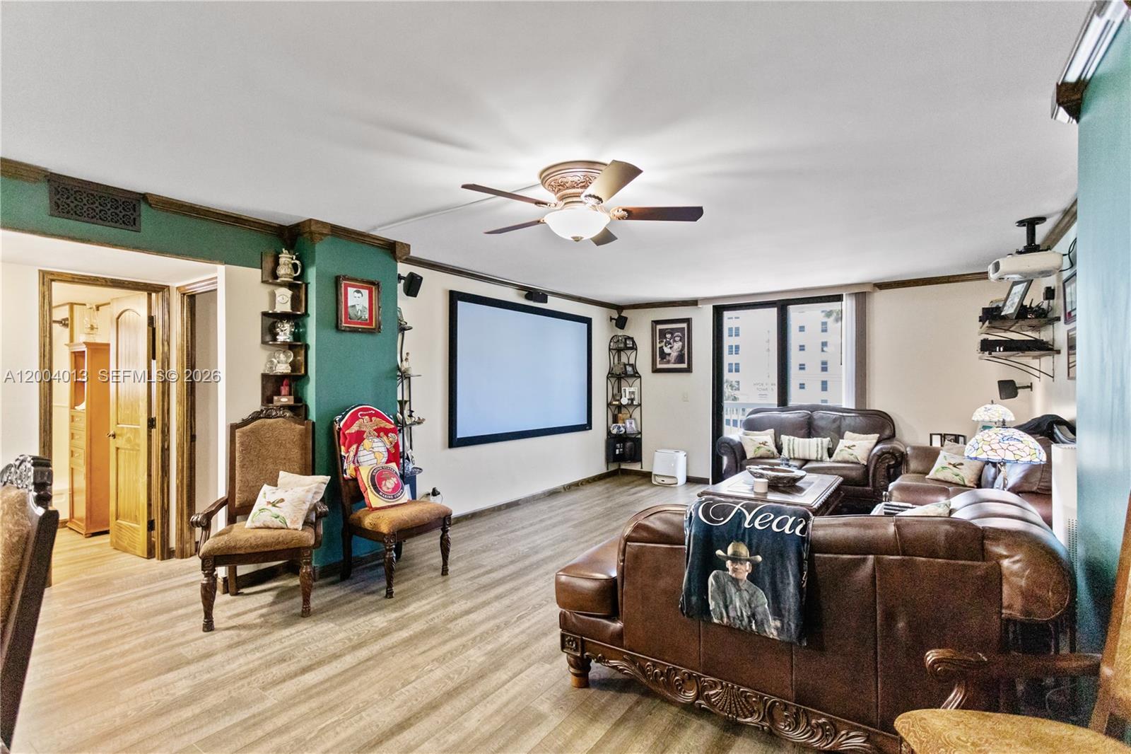 Enjoy coastal living in this beautifully updated 2-bedroom, 2-bath residence in the heart of Hollywood Beach. This spacious unit features a remodeled kitchen with quartz countertops and stainless steel appliances, along with updated flooring throughout and modern finishes. The unit includes impact windows and doors with heat-reflective tint, plantation shutters, and a newer A/C system (2023). Additional upgrades include updated electrical outlets with GFCI protection, new fans, custom shelving, and barn-style doors for added character and functionality. The primary suite offers a large walk-in closet with custom lighting, while the bathroom features a separate tub and shower layout. A Murphy bed adds flexibility for guests or additional space. Step out onto the expansive wrap-around balcony and enjoy Intracoastal views with the ocean just across the street. The unit also includes high-speed internet and cable (Hotwire). The building offers 24-hour security and resort-style amenities including a pool, gym, social room, bar area, and game room. Located just steps from the beach, dining, and entertainment, this is the perfect full-time residence or vacation retreat.