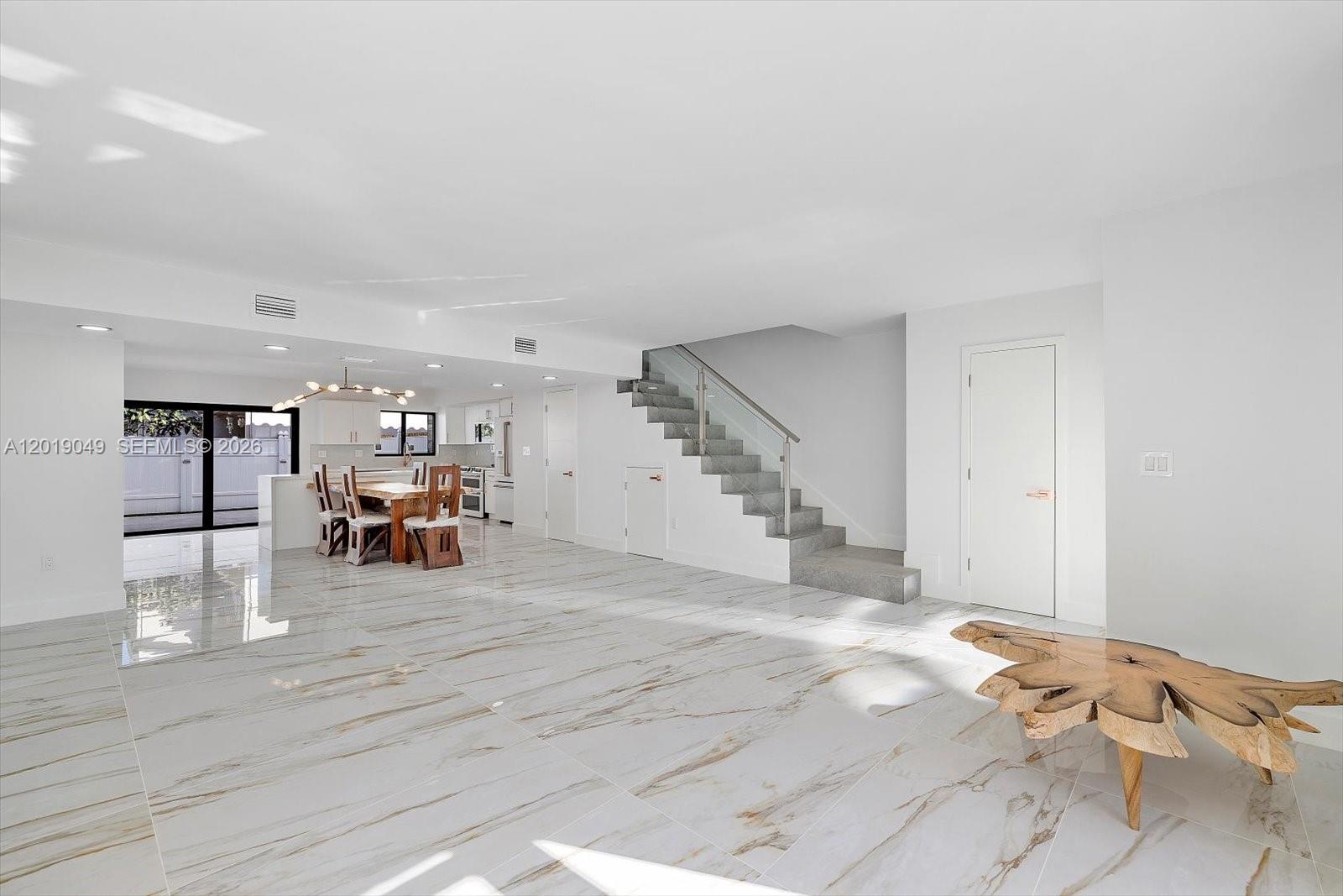 Exquisitely modern and totally renovated two story townhouse on great location. It has 1590 sf, 3 bedrooms 2 & 1/2 bath in desirable Lakeview development on Eastern Shores. Featuring all impact windows & doors, new modern Italian kitchen with island, exclusive Cafe collection of stainless steel appliances, new extra large porcelain floors, new modern bathrooms, in bathroom speaker system, new fence patio great for entertaining, over-sized balcony off master, new lamps plus recessed lighting throughout, all new a/c, high capacity washer & dryer. Steps to the pool area w/ 2 assigned parking spaces and plenty of guest parking. New recently installed roof. Close to the beach , Aventura mall ( Sunny Isles), close distance to restaurants, Oleta Park, Shopping, Houses of Worship, theater & more.
