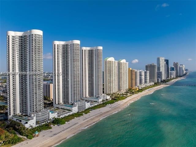 Oceanfront 3bedroom  3.5bathrooms flow-through residence at Trump Tower I. Offers breathtaking dual views: sunrises over the Atlantic and sunsets across the Intracoastal. 10ft ceilings and floor-to-ceiling impact glass flood the space with light, highlighting elegant marble floors throughout. The chef’s kitchen features Italian cabinetry, granite counters, and premium Sub-Zero and Miele appliances. Retreat to a lavish primary suite featuring a spa-inspired marble bath and private terrace access. Enjoy five-star amenities including 250ft of private beach with full service, an oceanfront heated pool, a state-of-the-art fitness center, and 24-hour concierge and valet. Located in the heart of Sunny Isles, you are minutes from Bal Harbour Shops and Aventura Mall.