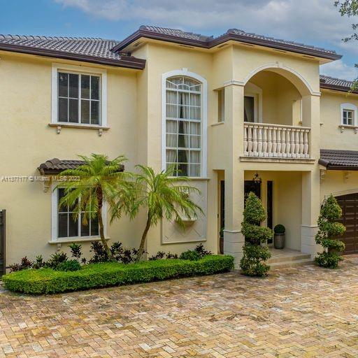 Lakefront mediterranean home with elegant iron stairwell which leads upto the large masterbedroom with balcony overlooking the waterviews .  This home has 4 bedrooms plus a loft which can be converted into a 5th bedroom and 3 bathrooms.  Gourmet kitchen opens to the family room and breakfast nook, beautiful living room and formal dining room, many windows illuminating the home with natural light and frech doors which open to the pool patio with 2 chickee huts with an outdoor kitchen and lage pool with jacuzzi by the serene lake.