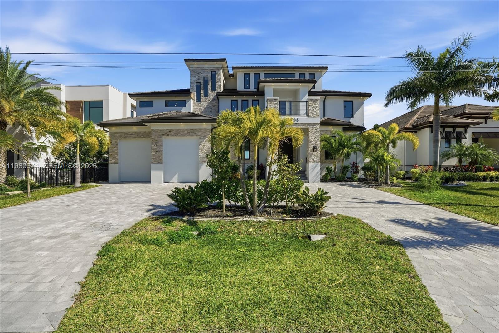 This is WOW Factor! Welcome to the most UNIQUE Waterfront Estate in all of SW Florida! This extraordinary 9,000-square-foot custom residence delivers the ultimate “Waterfront WOW Factor” here in Paradise. Engineered for strength and longevity, the home was constructed using (ICF) with 30ft pilings supporting both the residence and pool foundations, complemented by full IMPACT WINDOWS & sliders. This house is SOLID and BEAUTIFUL. Enter through dramatic SOLID-WOOD door, your eyes are drawn to the breathtaking Caloosahatchee River. ITALIAN MARBLE flooring leads to 5 Private Bedroom Suites - each with walk-in closets and spa-inspired full baths and walk-in showers. The Chef’s Kitchen is a true showpiece. Wolf double oven, Sub-Zero refrigerator, wine refrigeration, trash compactor, and a Wolf outdoor gas grill. The MBR is a private retreat with expansive windows and DUAL BALCONIES. The ensuite features dual vanities, a soaking Jacuzzi tub, and a huge walk-in shower with. Two additional en-suite bedrooms and a loft area complete the 2nd floor. A private ELEVATOR services all floors, including the 3rd floor. The house is Generator Ready with 8 HVAC Zones with separate handlers for each floor and the garage. Travertine Tile surrounds the oversized Infinity pool with a huge sun shelf. With no-bridge Gulf access, your boat reaches the Open Waters fast. This is more than a home... it is a fortified Waterfront Estate designed for luxury living in Paradise.