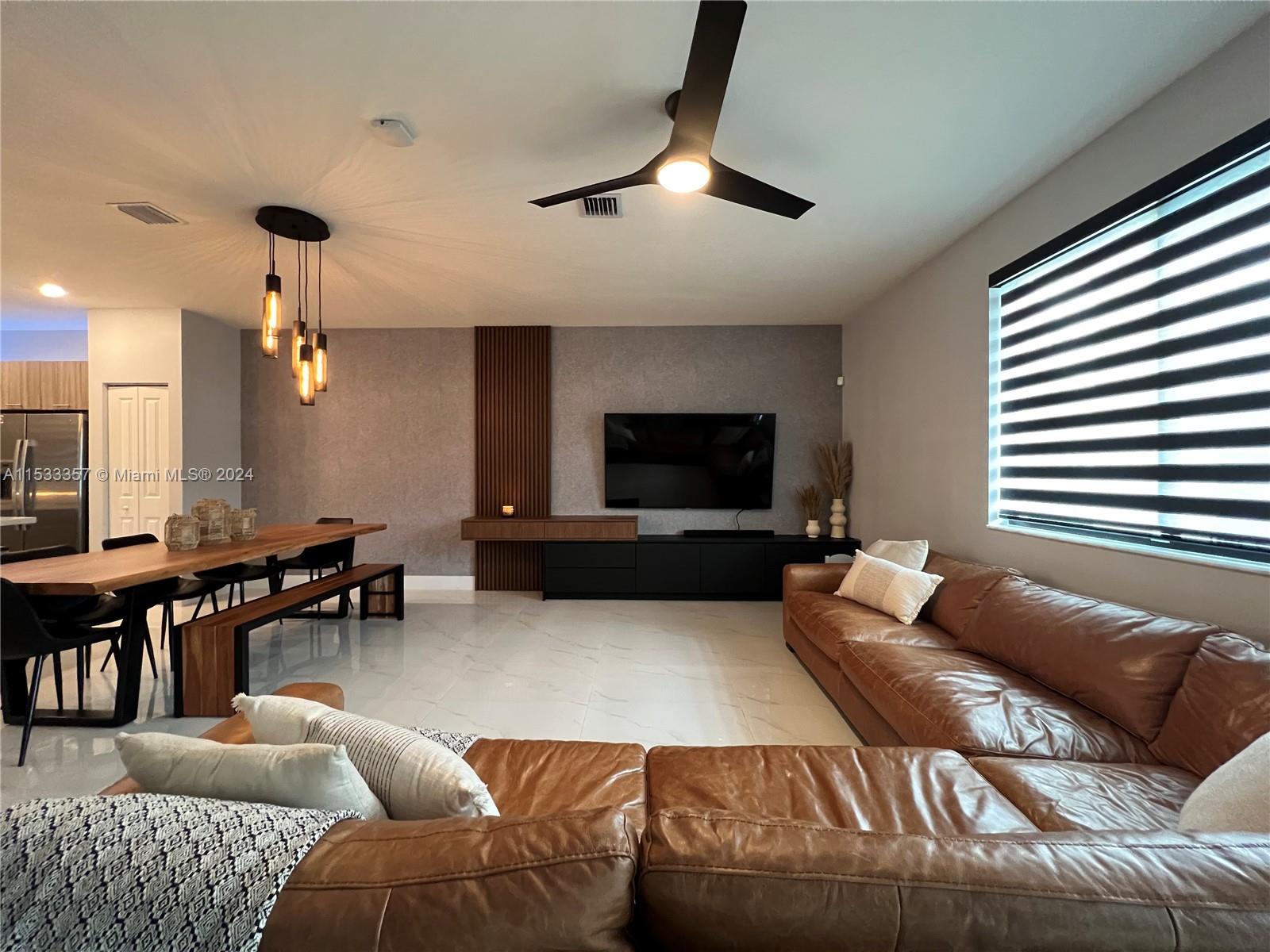 Welcome to this cozy and spacious 3 br / 2.1 ba townhome in the sought-after Urbana at Downtown Doral. It has been tastefully upgraded with black matte light fixtures, modern tv wall unit, custom window shades, fine wallpapers, and porcelain tiles on the first floor. This 2021 new construction unit offers an open floor plan with comfortable spaces and impact windows & doors. Urbana is a vibrant community offering resort-style living, with its Residences Club which offers a stunning pool with sundeck and poolside cabanas, elegant clubhouse, state-of-the-art fitness center, splash park for kids, and an indoor basketball court & running track. Situated just steps from Downtown Doral, residents can enjoy trendy restaurants, boutiques, and amenity-rich parks.
