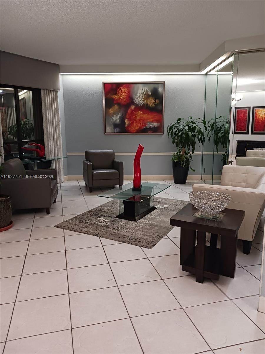 Welcome home to this 1120 sq ft unit in a 55+ community with the youngest resident being 19 yrs old. Showing beautiful flooring thru out. No carpets..SS appliances with updated cabinets and granite counter tops. Relaxing garden view..Electric Roll down Shutters on windows..Guard gated along with roving security and phone entry. Enjoy the New Legacy Park offering exercise equipment and Bar B Que/Picnic area. Lots of amenities including Pickle ball, tennis ct, billiard rm, computer rm and 4 Heated pools and men/women saunas. Assoc requires 20% down and a 700+ credit score. No pets..