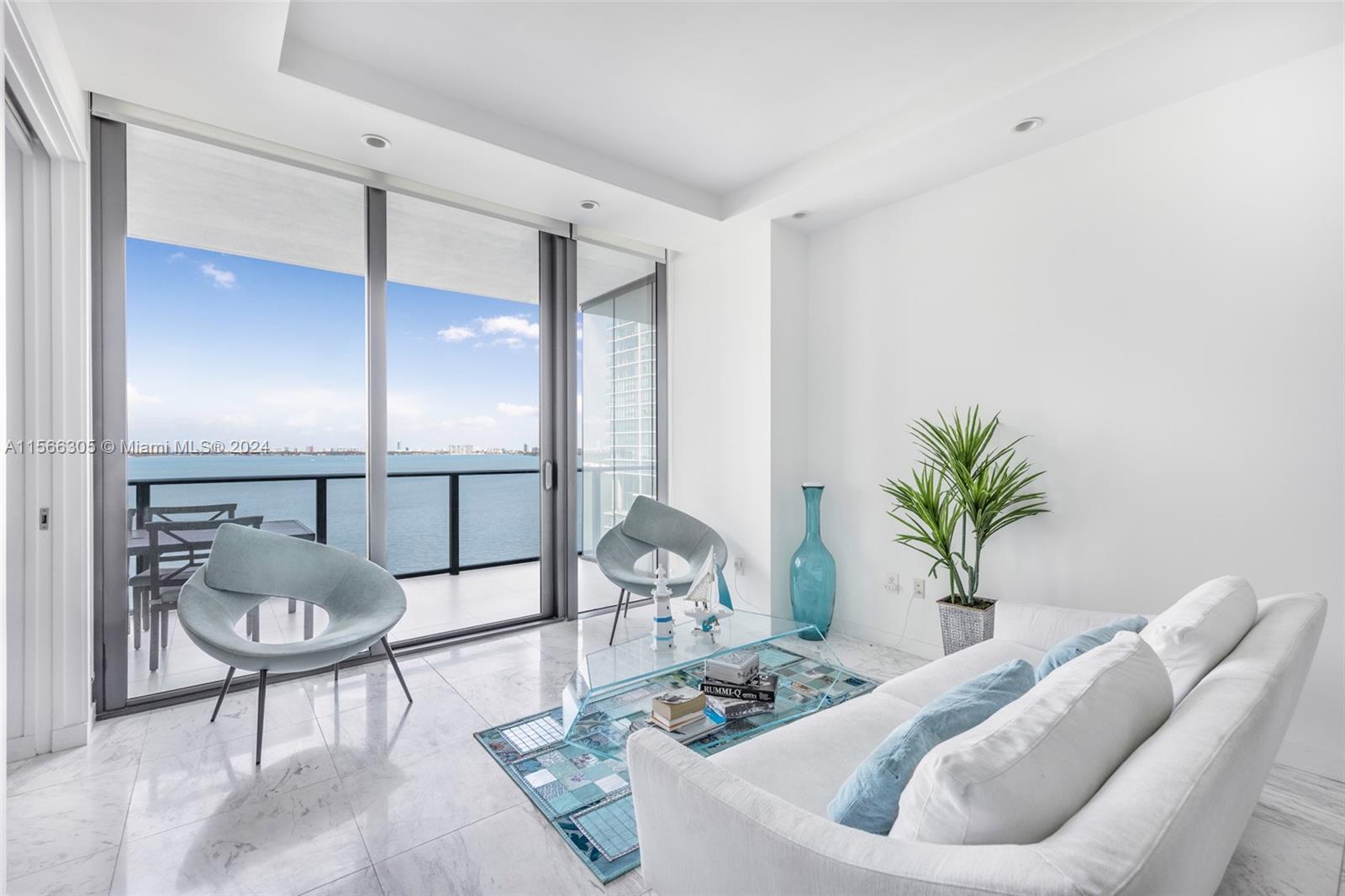Stunning furnished unit at Gran Paraiso with a spacious terrace, direct views of the bay, two beds/3 full bath, and a PRIVATE elevator. Finishes include top-of-the-line appliances, ceramic floors, and granite counter top; designed by renowned Piero Lissoni, it offers top-of-the-line amenities & services, including a two-acre pool deck, BBQ area, tennis courts, spa, gym, massage room, sauna, business center, theater, cigar lounge, private wine cellars, club rooms, lounge areas, children's playroom, bowling, golf simulator, and billiards. Residents can also access the acclaimed Amara at Paraiso Restaurant. Conveniently located near downtown Brickell, Midtown, Wynwood, and the Design District, within 15 minutes of MIA. Easy to show!