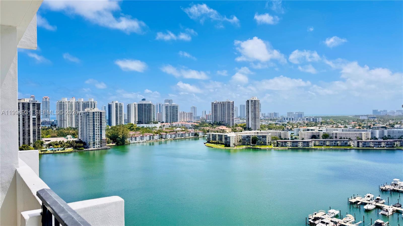 REDUCED FOR QUICK SALE - Stylish and spacious high-floor unit, clean and move-in ready with modern upgrades throughout. Features include a remodeled kitchen with granite countertops and stainless steel appliances, ceramic tile floors, renovated bathrooms, and a private balcony with stunning east-facing views of the lake, intracoastal, recently renovated pools, and marina. Open living/dining layout, primary suite with large walk-in closet. HOA includes cable, Wi-Fi, and hot water. Amenities include two heated pools, tennis courts, fitness center, marina, clubhouse, BBQ/picnic areas, billiards, ping pong, library, car wash area, attended lobby, concierge, 24/7 security, and assigned parking. Conveniently located, steps to shopping, restaurants, and entertainment. Minutes to Aventura Mall, parks, public transit, Brightline station, major roadways, and Sunny Isles Beach. 50-year Re-certification in progress; pending Special Assessment may require 30% down payment.