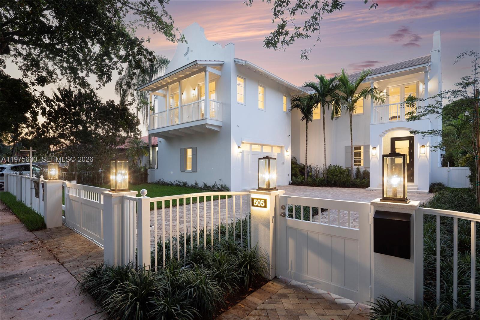 Exquisite modern Dutch–Caribbean masterpiece offering the perfect blend of architectural sophistication and relaxed luxury living. Secured motor court entry with a two-car garage welcomes you into this spectacular two-story residence featuring 4 bedrooms, 5.5 baths, and a dedicated ground-level office (also serves as bedroom with ensuite bathroom). Designed by award-winning Locus Architecture, the home showcases dramatic scale and seamless indoor-outdoor flow. Expansive living spaces featuring a mud room, 20ft ceilings, wine cooler bar and open spaces to a covered kitchen and summer entertaining area overlooking a stunning pool deck ideal for hosting or everyday family living. Every bedroom features its own private covered balcony, ensuite bathroom and walk-in closet creating serene retreats throughout and comfortable living. The chef’s kitchen is fully outfitted with top-of-the-line Sub-Zero, Cove and Wolf appliances, complemented by custom cabinetry by Mia Cucina throughout the home, delivering exceptional craftsmanship and refined detail at every turn. A rare offering combining architectural pedigree, premium finishes, and effortless elegance.
