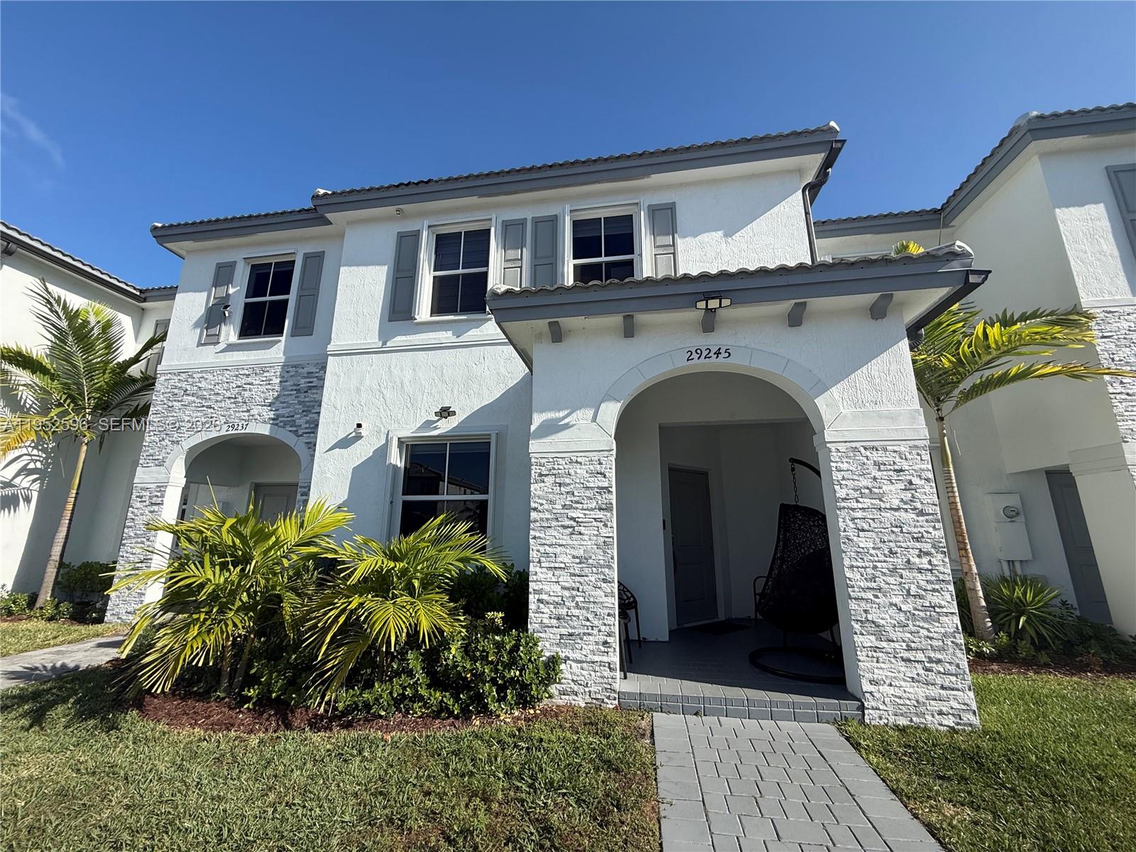 Experience modern living in this beautiful 3-bedroom, 2.5-bath townhome in Cedar Pointe, a new construction community in Homestead. Offering 1,687 sq ft of stylish living space, this home features tile flooring throughout, interior and exterior security cameras, hurricane shutters, and elegant glass doors that enhance its modern design.
The first floor includes a thoughtfully designed additional studio, ideal for a home office or flex space. Step outside to a stunning covered and paved terrace, perfect for entertaining or relaxing. This newer property truly stands out for its upgrades, comfort, and contemporary appeal.