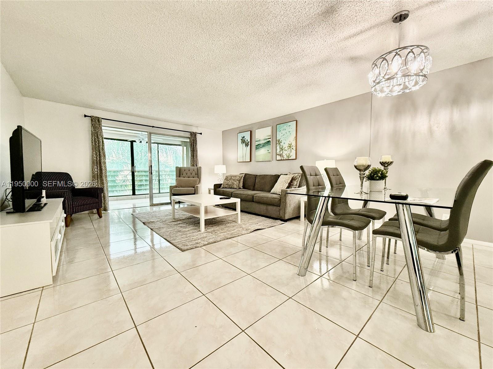 Enjoy beautiful lake views from this spacious 2 bedroom, 2 bathroom condo featuring a large and well designed floor plan with generous living areas. New carpet in both bedrooms adds comfort and a fresh feel. The unit includes a convenient assigned parking space located close to the elevator, plus a private storage unit. Excellent amenities include a heated swimming pool, clubhouse, BBQ grills, and car wash station, all within a very nice and quiet community. Ideally located just one mile from the beach and steps from supermarkets, restaurants, Dania Beach Casino, and more. At least one resident must be 55+