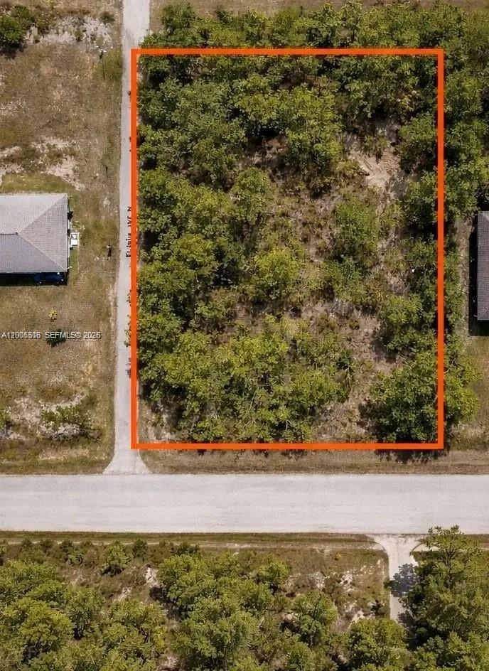 Fantastic opportunity to secure a 10,803 sq ft (approximately 0.25-acre) west-facing residential lot in one of the fastest-growing areas of Lehigh Acres. Surrounded by a significant amount of new construction and ongoing residential development, this parcel is ideal for building your dream home or for investors looking to capitalize on the area’s steady growth. Offering approximately 80 feet of frontage and 125 feet of depth, this lot provides ample space for a custom single-family residence with room for a spacious yard, pool, or outdoor living area. Located on a paved road with established homes nearby and numerous new builds throughout the neighborhood, reflecting the strong upward trend in development. Conveniently situated near schools, parks, shopping centers, restaurants, and major roadways providing easy access to Fort Myers, I-75, and Southwest Florida International Airport. Lehigh Acres continues to experience consistent expansion, making this a strategic opportunity to buy land in a rising market. No HOA. Buyer to verify utilities, flood zone, and building requirements with Lee County