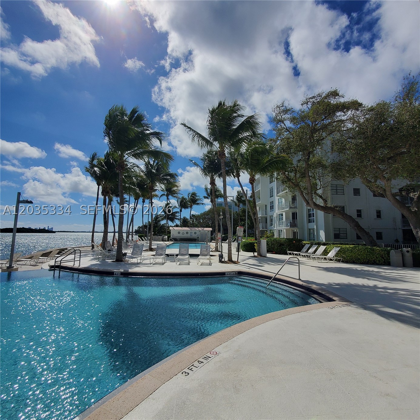 Welcome to your bayfront urban oasis! This spacious 1-bedroom, 1-bath residence is located in a gated, dog-friendly community surrounded by lush tropical landscaping and unique atrium-style buildings. The home features a modern kitchen, tile and wood floors, three closets for ample storage, on-site laundry, and a spacious private balcony. Enjoy resort-style amenities including two pools (lap pool and leisure pool), a Jacuzzi, beach area, BBQ and picnic spaces, beach volleyball court, kayak storage, bike storage, and poolside restrooms. An on-site convenience store adds everyday convenience, while nearby parks and recreational areas offer endless opportunities to enjoy the outdoors. The unit includes one assigned parking space, with a second space available through the association for only $25/month. Experience the perfect blend of waterfront serenity and city convenience in this beautifully maintained bayfront community. Short drive away to Miami Beach, Design District, Midtown, & Down town/Brickell.