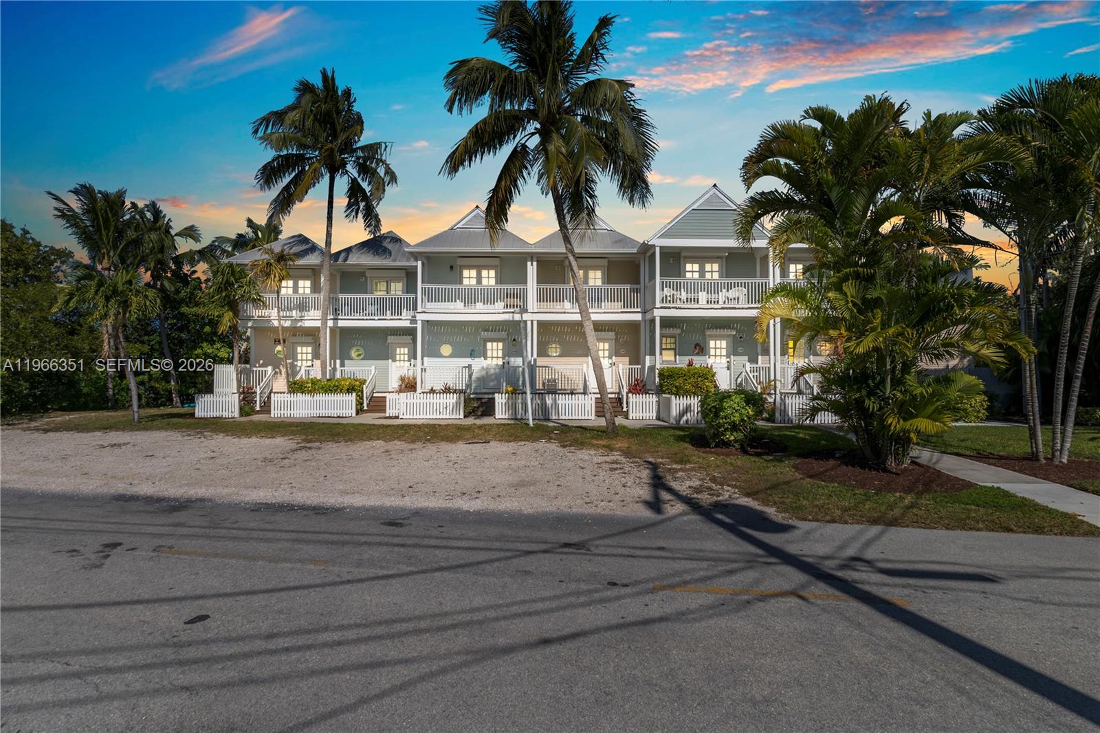 Well-maintained Conch-style villa overlooking the clear waters of Sunset Village on Duck Key, located within Hawk's Cay Resort. Enjoy breathtaking sunsets from both the upper and lower private patio decks. This 2-bedroom, 2.5-bath residence offers a comfortable and functional layout with recently remodeled bathrooms and additional updates throughout. The washer and dryer have been recently replaced, along with the refrigerator. The design allows for seamless indoor-outdoor living, ideal for enjoying the coastal setting. Step outside to a manicured green lawn leading to a charming pocket beach area, perfect for relaxing, wading into the water, or enjoying the peaceful waterfront atmosphere. Ideally positioned just steps from the Sunset Pool with beautiful open water views nearby. Excellent income-producing opportunity with eligibility to participate in the resort rental program, offering nightly rental capability.