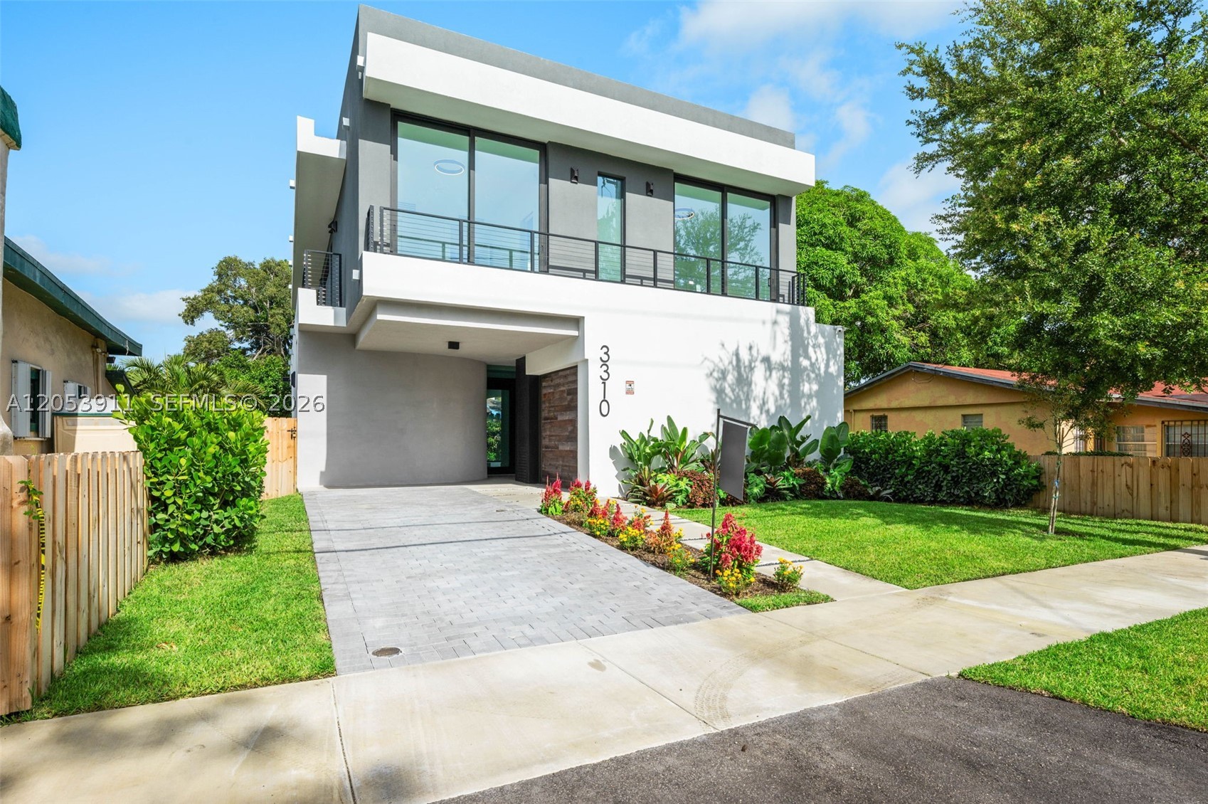 4-bedroom, 4-bath contemporary residence with an air-conditioned garage that can easily serve as a home gym, office, media room, or playroom. This one-of-a-kind home features a truly unique architectural design (not your typical cookie-cutter home) with soaring double-height ceilings in the living room, floor-to-ceiling glass, glass railings, abundant natural light, and lush greenery surrounding the property for exceptional privacy and tranquility. Each bedroom offers its own en-suite bathroom, including a private first-floor guest suite with an independent entrance. Premium Dacor and Miele appliances, porcelain tile flooring, and porcelain finishes in the kitchen and bathrooms elevate the home's modern design, while custom LED accent lighting in the kitchen, bathrooms, and staircase enhances its sophisticated ambiance. The spacious primary suite opens to a private balcony with an open-air jacuzzi, creating the perfect setting to relax under the stars. Enjoy a heated pool with a sun shelf, rain shower, beautifully landscaped outdoor spaces with an irrigation sprinkler system for easy maintenance, and an expansive rooftop terrace ideal for entertaining. An aluminum electric privacy fence is also being installed, adding both security and curb appeal. Located in the heart of Coconut Grove, this exceptional home is within walking distance to the village center, restaurants, cafés, shopping, parks, and marinas, offering the best of luxury indoor-outdoor living.