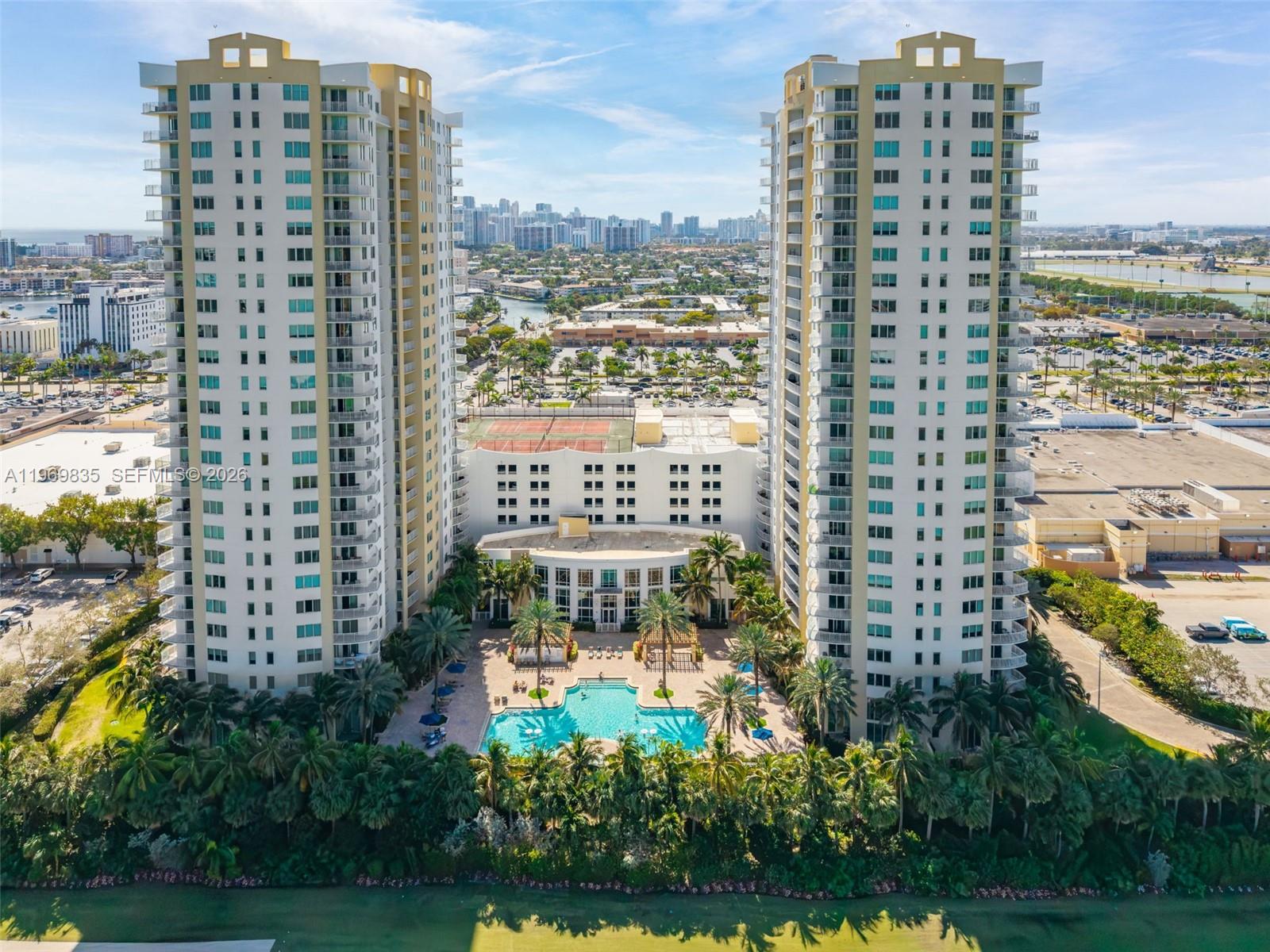 Spacious and bright 3-bedroom residence featuring two assigned parking spaces on the same floor for added convenience. Ideally located just minutes from the beaches, Aventura Mall, and the new Shell Bay – Auberge Resorts Collection luxury development, supporting long-term area growth. The building has successfully completed all required milestone inspections. Maintenance includes reserves, water, cable, internet, appliance service coverage, and full amenities.Rentals permitted twice per year (minimum 6 months).