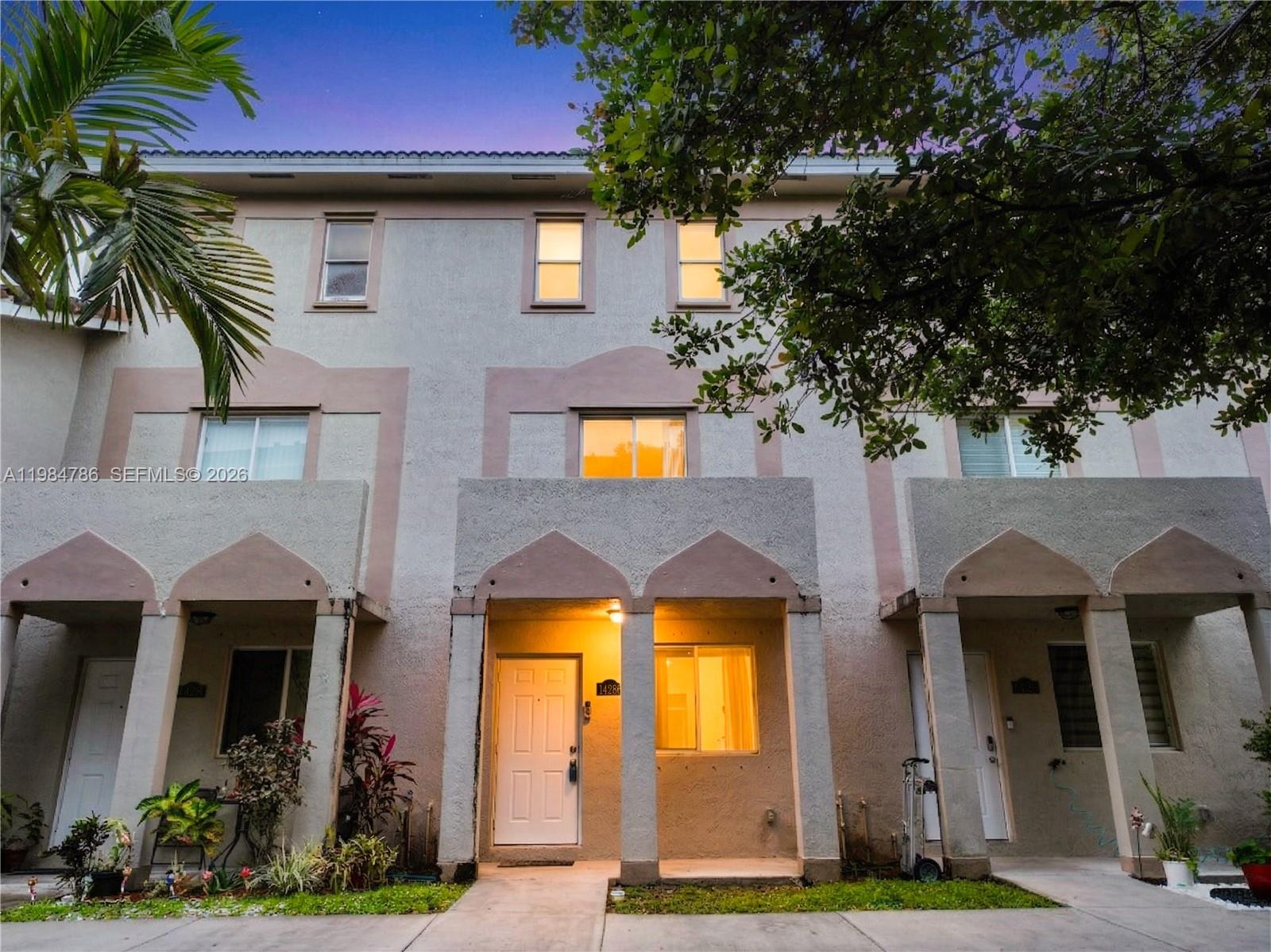 **Eligible for 1% DP Conventional loan** $10,000 CREDIT TO THE BUYER AT CLOSING. Welcome to this well-maintained three-story condo featuring 3 bedrooms and 2.5 bathrooms, ideally located in the heart of the city. This home offers a spacious living and dining area, perfect for everyday living and entertaining. The functional kitchen is equipped with stainless steel appliances and built-in cabinets, providing ample storage. A convenient half bathroom is located on the first level. The second floor includes two well-sized bedrooms and a full bathroom, while the entire third floor is dedicated to the primary suite, complete with two walk-in closets and a private en-suite bathroom. Step outside to a fully fenced yard with additional storage, ideal for relaxation or extra space. The property includes two assigned parking spaces along with ample guest parking. Situated in a quiet neighborhood with easy access to I-95, the Turnpike, and the 826 Expressway, this home combines comfort, convenience, and location. Enjoy the 3D tour. May your best start here!