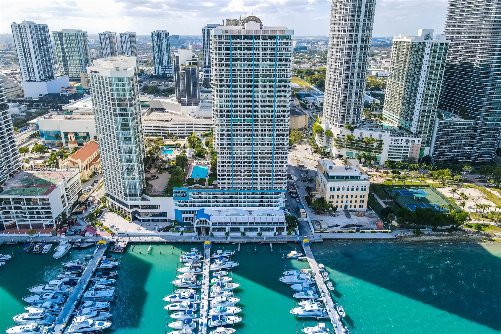Turnkey, fully furnished 1 bed, 1.5 bath at The Grand, a full-service waterfront tower on Biscayne Bay in Edgewater. Open layout with a stainless kitchen, granite counters, wood and ceramic flooring, walk-in closets, in-unit washer and dryer, and full impact windows. Resort-style amenities include a heated bayfront pool and hot tub, fitness center, spa, on-site marina, 24 hour security, attended lobby, and valet, plus on-site retail, restaurants, and services including a Starbucks. One assigned garage space. Steps to the Arts and Entertainment District, Kaseya Center, Adrienne Arsht Center, and Bayfront Park, minutes to Brickell, Midtown, the Design District, and Wynwood. Cable, internet, water, hot water, and pool maintenance included.