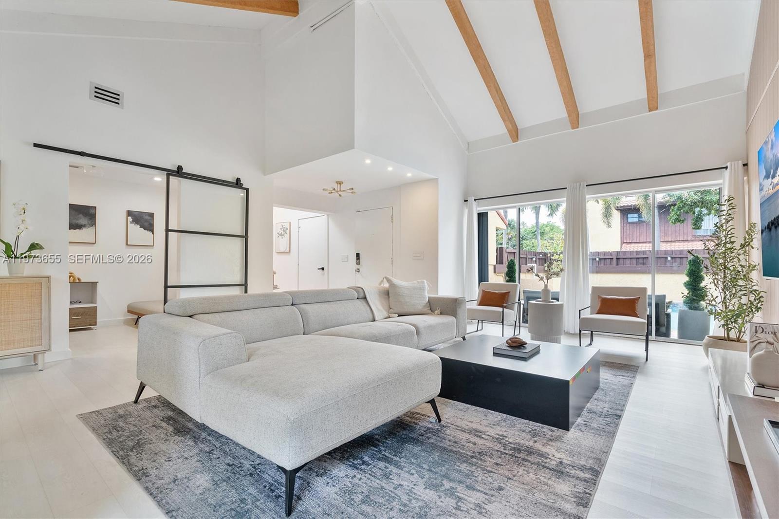 ***OPEN HOUSE May 31,2026 LOOK FOR MARISA KOOIMA ON CALL BOX FOR ACCESS*** Welcome to this completely redesigned 2-bedroom, 2-bathroom home with a flex room perfect for a den, office, or guest space. The open-concept kitchen is the heart of  the home, featuring a quartzite waterfall island and 2025 Samsung Bespoke smart appliances, ideal for cooking or entertaining. Smooth skim-coated walls and ceilings, fresh white paint, luxury vinyl flooring, and square hi-hat lighting create a bright, modern atmosphere throughout. Exposed wood beams have been sanded to their natural color, adding warmth and character, while decorative slat wall panels, custom wallpaper, updated air vents, modern fixtures, and LE Grand light switches elevate the details. The garage is already plumbed for an additional bedroom and bathroom, with plans available, offering a rare opportunity to expand living space. Just outside you'll find a heated saltwater courtyard pool with a papered deck, perfect for private, year-round enjoyment. Major updates include a 2024 flat roof, 2018 HVAC, and updated water heater. Maintenance includes paint, WiFi, cable, and front yard care. A turnkey home with luxury finishes, thoughtful upgrades, and room to grow. This property will not last.