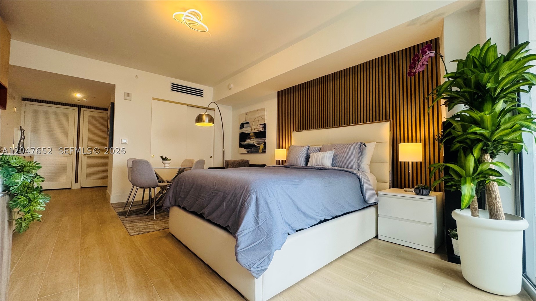 This FULLY FURNISHED and Upgraded CORNER STUDIO is available for SHORT TERM RENT, From 1 MONTH UP to 12 MONTHS Lease. Professionally decorated by an interior designer, featuring electric motorized shades, decorative accent walls, A/C and lighting controlled from your smart phone. This is ONE OF THE FEW STUDIO LINES NOT FACING THE PARKING GARAGE, instead the North facade offers panoramic Midtown Skyline views. 
*** 
READY TO MOVE IN: Queen-size bed, convertible sofa bed, dining table for 4 people, bathroom with dual shower head & glass door, spacious entry foyer, private corner balcony overlooking both Sunrise and Sunset. All included: bed & bath linens, kitchenware, cookware & dishware, closet includes racks & drawers.
***
BRAND NEW, never-occupied condo featuring Bosch appliances, induction cooktop, built-in oven/microwave, full size refrigerator, full-size washer/dryer, dishwasher. Utilities included: Water and high-speed internet.
***
 The Standard Midtown Miami is a boutique residential building where you can LIVE, WORK, EXERCISE & ENTERTAIN just in one place. Rooftop Pool with panoramic city views, Fitness Center, Sauna, Pickleball court, Cinema/Media Room, Social Lounge, Co-Working Spaces, Business Lounge & Private Meeting Rooms. Prime location directly across from Trader Joe's and just steps Design District, Wynwood, Edgewater. Monthly rate may vary depending on lease term
*** 1 PARKING SPACE AVAILABLE, 2nd parking available *** ONLY 1 MONTH DEPOSIT TO MOVE IN