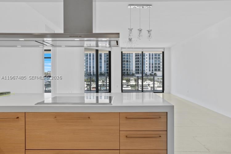 This 2-bed, 3-bath apartment offers style and comfort with panoramic Marine views.
The spacious balcony, accessible from the living room, master suite, and guest bedroom, is perfect for sunrises and sunsets.