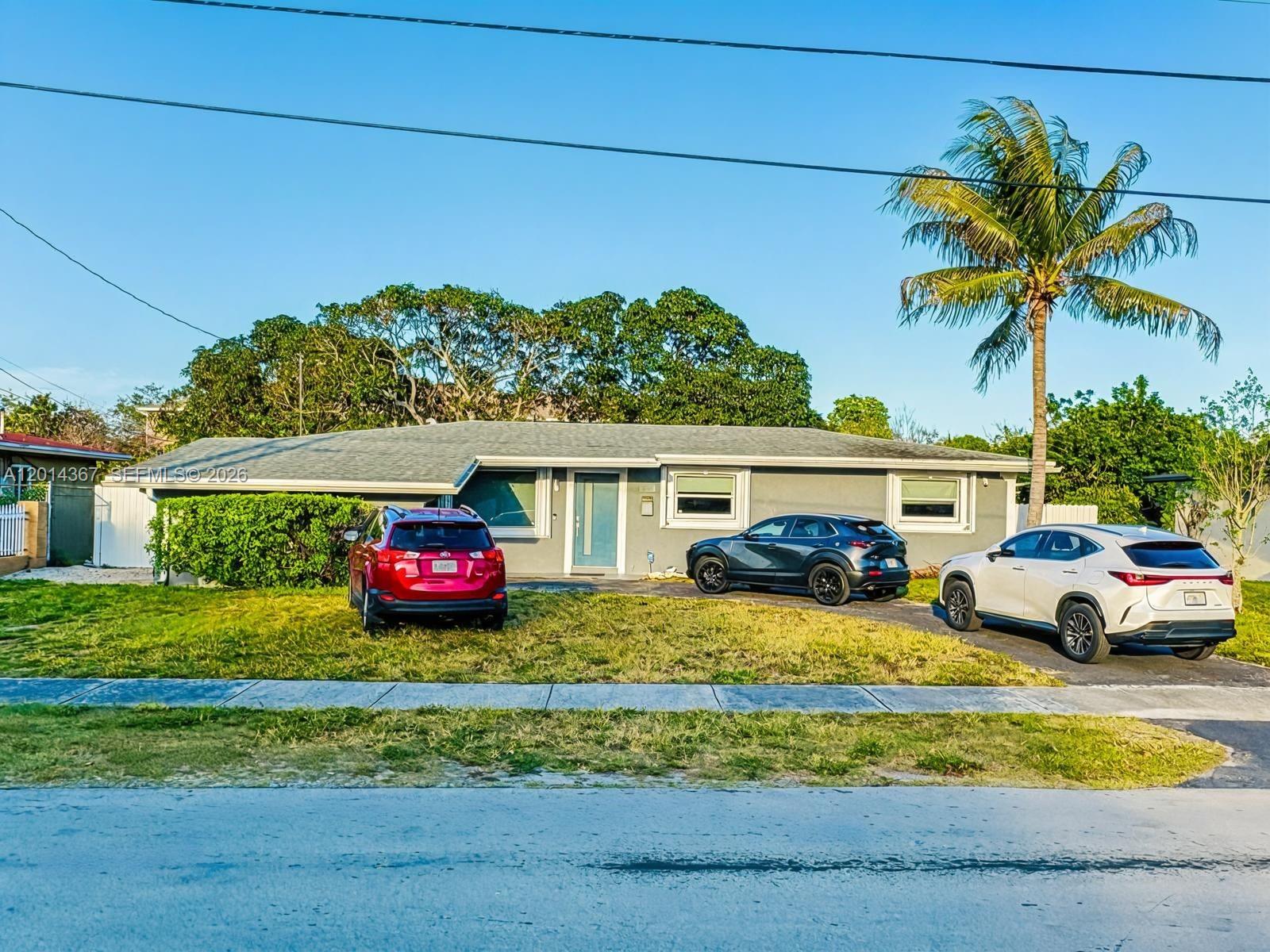 Beautiful & spacious single-family home ideally located in a highly convenient area of Miami Gardens This well-maintained residence offers the perfect combination of comfort, functionality, & modern upgrades, making it an excellent fit for large families, multi-generational living, or buyers seeking flexible living space
Featuring 5 bedrooms, 3 full bathrooms, a bright & inviting living room, a large family room, & a dedicated office space ideal for working from home. The flexible layout provides generous interior space with multiple living configurations to suit a variety of lifestyles
The modern kitchen is beautifully updated with high-end stainless-steel appliances, stylish cabinetry, and ample counter space, designed for both everyday living and entertaining. A separate laundry area includes washer and dryer for added convenience
One of the standout features of this property is its spacious backyard with fruit trees, offering a natural, private, and enjoyable outdoor setting
Additional highlights include a newer A/C system & a roof replaced in 2020. Exterior features include a covered carport, large patio ideal for entertaining, & a permitted shed providing extra storage. The rear canal location adds additional privacy with no immediate rear neighbors
Conveniently located near shopping centers, restaurants, schools, parks, entertainment, & major highways. A rare opportunity to own a move-in ready home with exceptional space, upgrades, & outdoor charm in South Florida