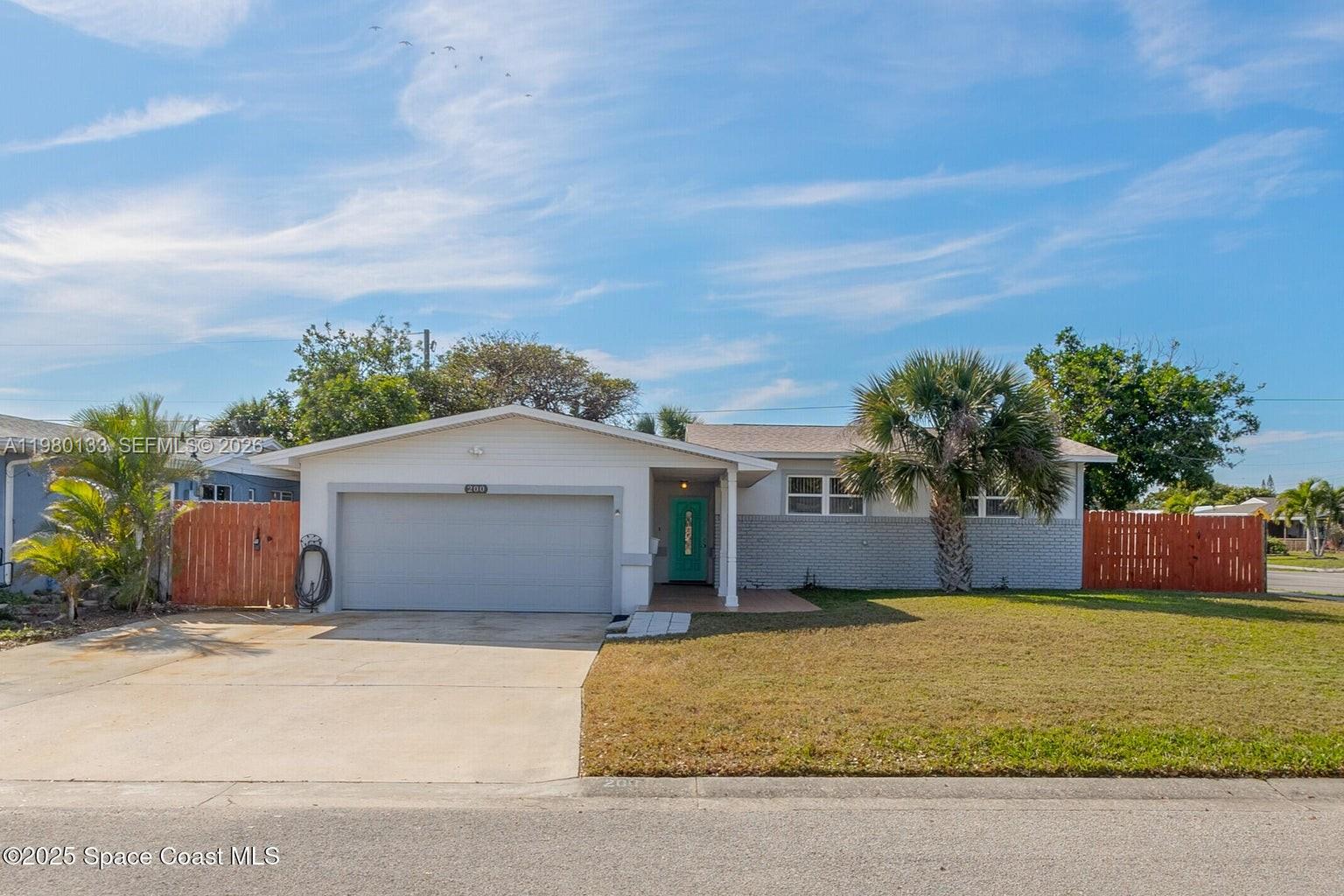 NEW PRICE! A Beachside 5 Bedroom, 2 Bath, 2 Car Garage, Corner Lot Home Just A Few Blocks to the Beach under $500,000! This home is perfect for a large family or multi-generational comfy living. It boasts an upgraded kitchen with granite countertops, stainless steel appliances, breakfast nook and plumbed ready to enlarge if needed. Additional entryway closet is plumbed for creating a half bathroom if you desire. The flooring has upscale tile and wood in high-traffic areas and comfy carpet in bedrooms. The backyard is decked out with wood flooring and a fun tiki hut to enjoy the beautiful beachside weather! Whether you do like the locals and take a golfcart, bike or walk the few blocks to the beach, you will enjoy the pristine beach lifestyle living in this home will provide. Schedule a showing and make this home yours today!