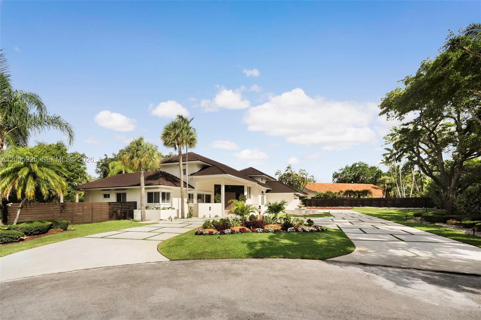 A beautifully upgraded waterfront residence in the guard-patrolled community of Galloway Glen, set on a 23,133 SF cul-de-sac lot with serene canal views. This elegant two-story home offers 6 bedrooms and 5.5 bathrooms, with soaring ceilings, abundant natural light, and a seamless blend of marble and newly installed porcelain flooring throughout, including the staircase and bedrooms. The renovated primary suite features a spa-like bath and custom closets completed in 2025. The kitchen is appointed with wood cabinetry, granite countertops, stainless steel appliances, and a dedicated coffee station, flowing into a spacious family room with wet bar and striking tongue-and-groove ceilings. Outdoor living is enhanced by a saltwater pool, expansive covered Saturnia marble patio, and a gazebo with BBQ. Additional features include impact windows and doors, plantation shutters, generator, multiple A/C systems, and a 2-car garage. Per appraisal, larger than tax roll.