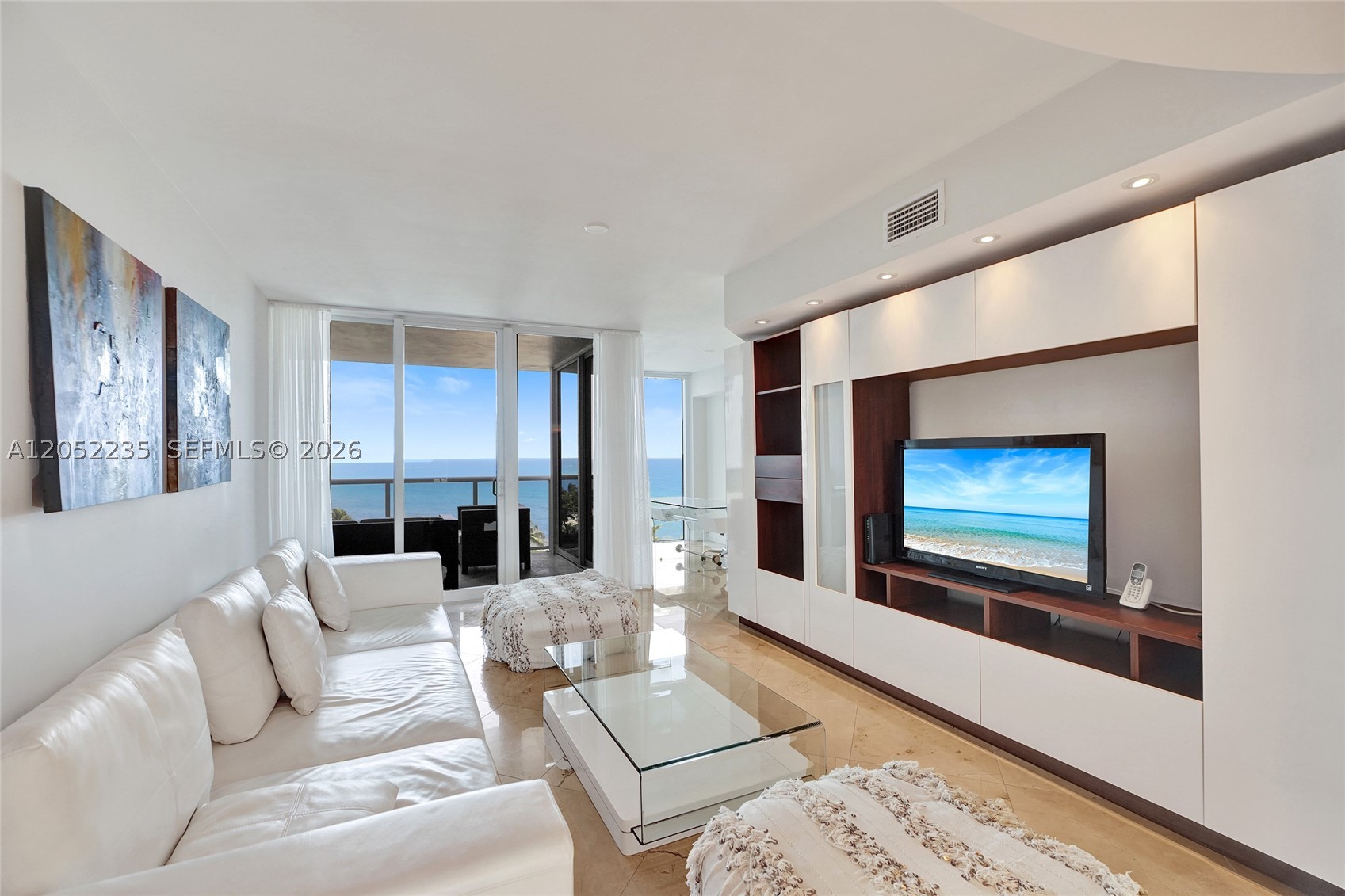 Ocean Two Condo in Sunny Isles Beach offering 2 Bedrooms and 2.5 bathrooms plus den with stunning Ocean Views! FURNISHED, Spacious, modern & bright condo w/ 1,900 sq ft interior plus two large balconies with sunrise & sunset views. Marble floors & wood floors throughout. Modern, bright & spacious unit. Private elevator foyer entry, separate laundry room, eat-in kitchen. Master Bedroom has  large walk-in closet and balcony access. Interior common areas  renovated by Steven G. Designs. Amenities include restaurant, beach and pool service, heated pool, hot tubs and spa with sauna and steam. Billiard room, massage room,  Front desk, valet and security. Two story gym, two tennis courts, kids playroom and dog park.