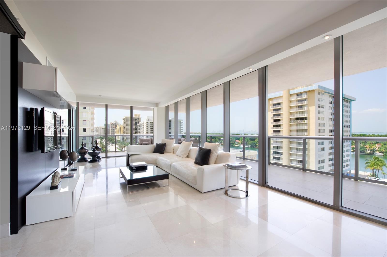 Welcome to Residence 1008 at MEi, an oceanfront jewel along prestigious Millionaires Row at 5875 Collins Avenue in Miami Beach. This exceptional 3-bedroom, 3.5-bath residence embodies refined coastal luxury, offered fully furnished and impeccably curated for effortless, turnkey living.
Thoughtfully designed and professionally appointed, the interiors showcase elegant limestone and marble flooring, rich teak veneer cabinetry, and polished granite countertops complemented by a suite of premium stainless-steel appliances. A built-in wine cooler and espresso station enhance everyday indulgence, while custom-designed closets provide both sophistication and seamless organization.
Expansive floor-to-ceiling glass walls frame breathtaking views of the Miami skyline, bathing the open living spaces in natural light and creating a harmonious flow between the serene interiors and the shimmering shoreline just beyond.
MEi offers a boutique luxury lifestyle with resort-style amenities, direct beach access, oceanfront pool, fitness center, spa, concierge, and 24-hour security. Residence 1008 is the perfect balance of sophistication, comfort, and prime beachfront living ready to be enjoyed immediately.
