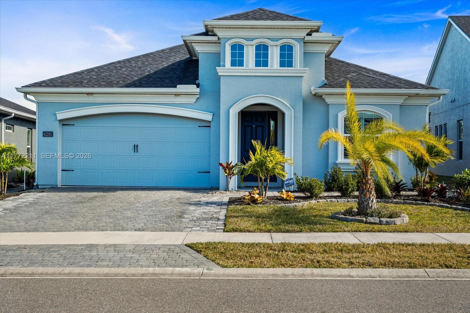 Welcome Home! This stunning 4BD/3BA + flex room, built in 2022, has 2,943 SqFt of luxurious total space. Situated on a pond, every detail has been upgraded w/ HIGH-END LUXURY FINISHES, including appliances and light fixtures. 2 car garage, enlarged paver driveway, & upgraded landscaping for an impressive curb appeal. A true backyard oasis built for privacy, complete with a full screened SALTWATER & HEATED POOL, astroturf, Bahama shutters, new outdoor lights, and a fan. Perfect for relaxing or entertaining! Inside, you'll find custom blinds, window tinting, and a custom-built foyer. Features a whole-house water filter and softener system, a scent system, upgraded tech-level WiFi & cameras, and SO MUCH MORE!
