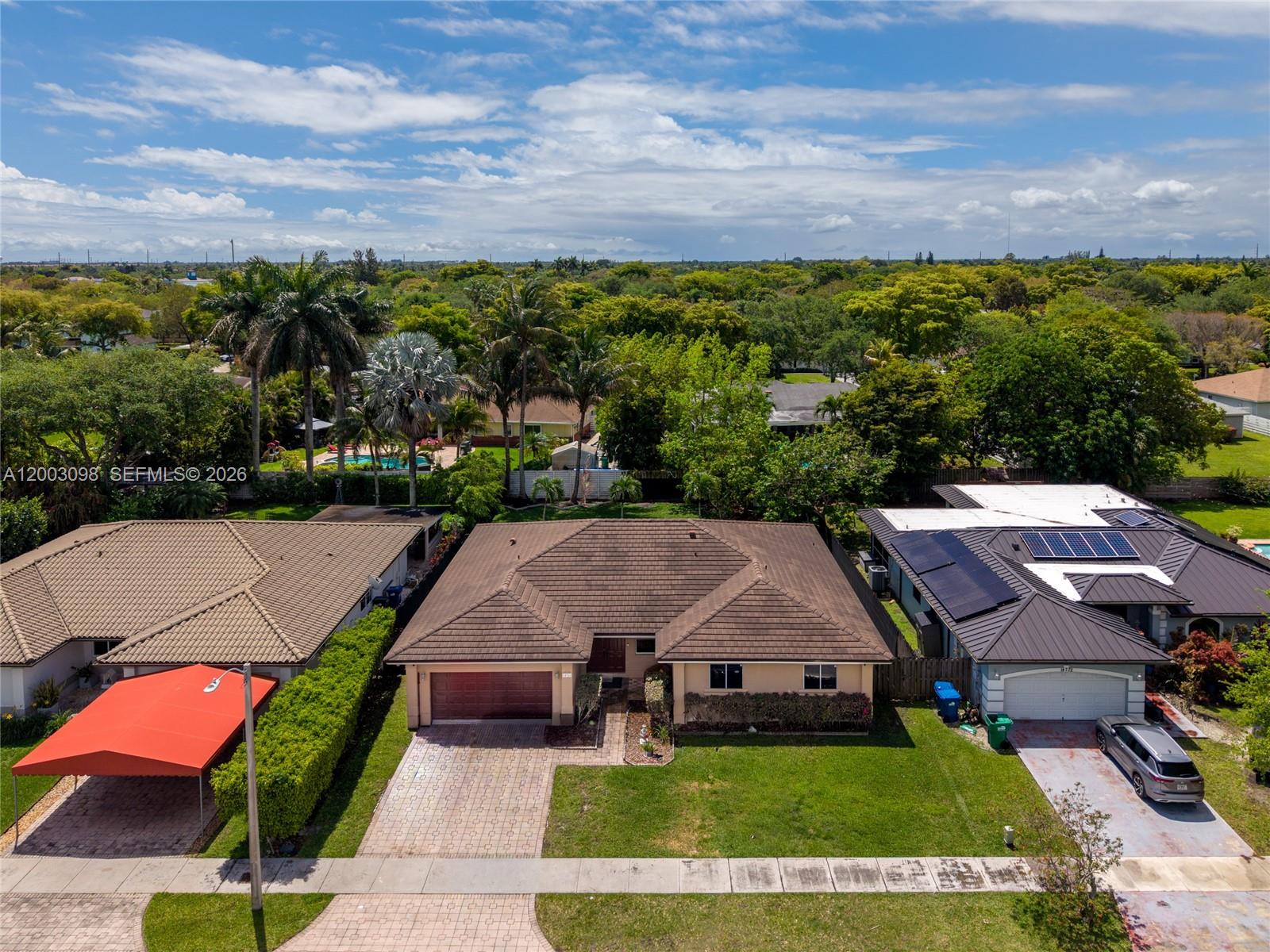 4 bedroom, 3 bathroom home with over 2700 sq ft living area on a 10,500 sq ft lot. 2 car attached garage with Laundry. Spacious Living, Dining and Family areas. Eat-in Kitchen with counter and lots of room. Truly spacious home. Ceramic Tile throughout. Heart of Country Walk / West Kendall. Next to Tamiami Airport, shopping, dining and more.