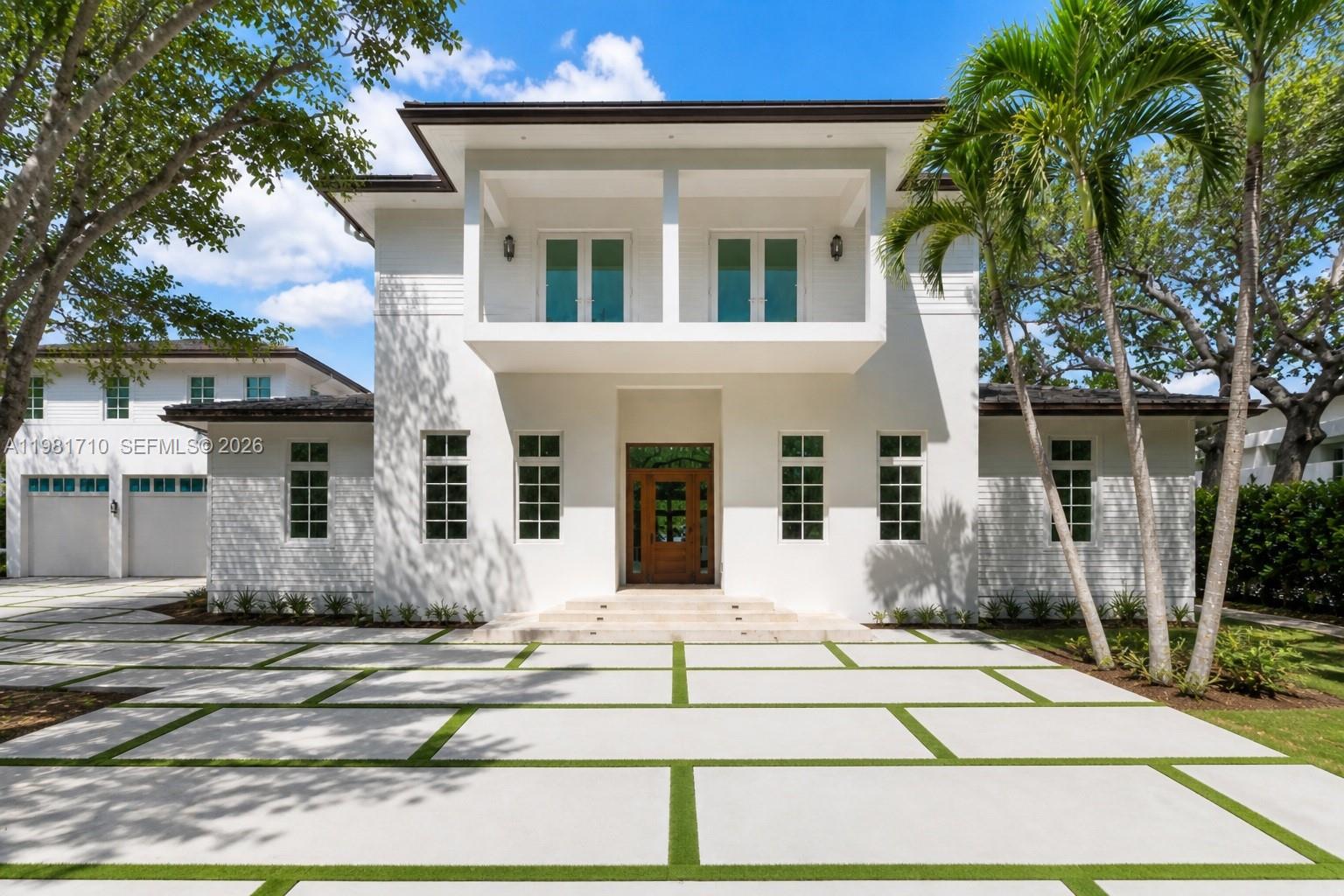 Experience elevated coastal living in the heart of Palmetto Bay. This brand-new, just-completed construction offers 7 bedrooms, 8 bathrooms, and 1 powder room, blending breezy elegance with thoughtful craftsmanship. Custom cabinetry and designer appliances anchor the gourmet kitchen, while light-filled living spaces create a relaxed coastal ambiance. The primary suite features a spa-inspired bath with a striking tub-in-shower design. Dual-level laundry rooms add everyday convenience, complemented by a home theater and a private library/office. A garage loft provides ideal guest or in-law quarters. Outdoors, enjoy a covered terrace with a summer kitchen and cabana bath, creating the perfect setting for seamless indoor-outdoor living. Thoughtfully designed with refined finishes and modern functionality throughout, this exceptional new residence is ready for immediate occupancy.