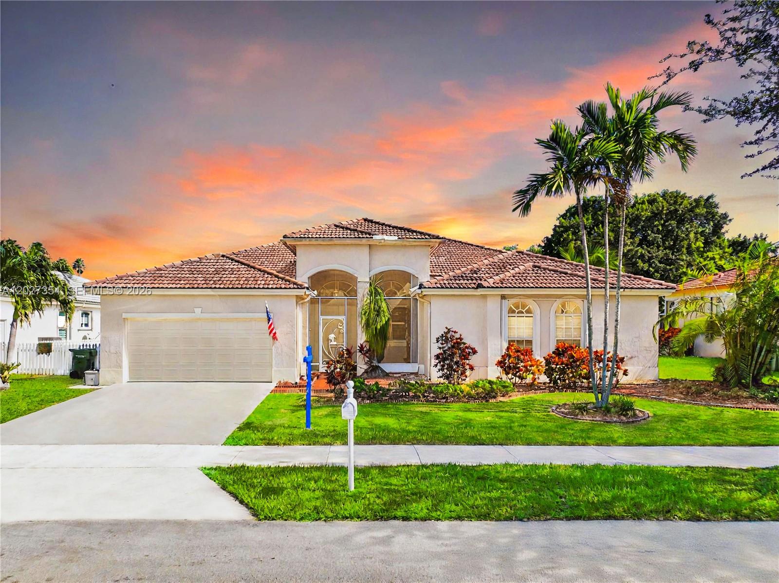 Nestled within the gated golf community of The Fairways, this impressive 5-bedroom, 4-bath residence (2 full, 2 half baths) offers a tranquil setting and exceptional privacy. Positioned on a generous 11,700 SF homesite backing the golf course, enjoy picturesque green views and direct fairway access. The interior showcases soaring ceilings, ceramic tile floors, and expansive windows that fill the home with natural sunlight. The well-appointed kitchen features stone counters, modern appliances, abundant storage, and opens seamlessly to the main gathering spaces. The oversized owner's retreat includes a large walk-in closet and an elegant ensuite with a soaking tub and separate shower. Relax or entertain year-round on the 40-foot screened lanai complete with a 14-foot swim spa. HOA dues include high-speed internet and DirecTV. Optional club membership available. May your best start here!