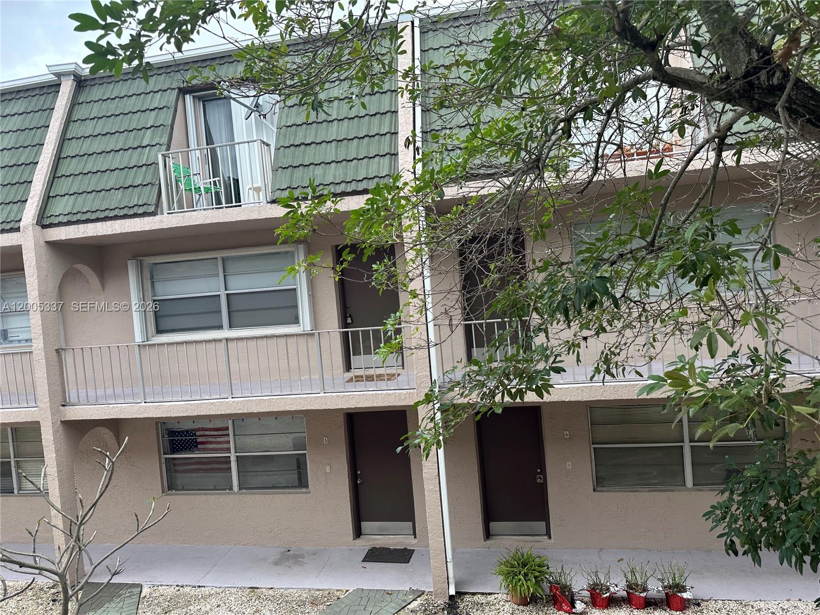 Investor's welcome! IMMEDIATE LEASING PERMIT AND PETS ALLOWED. Townhome style, located in a small complex in East Deerfield Beach only 2.3 miles to the beach. This beautiful 2 story condo with 2 bed. & 2 bath featuring a large living & dining area, open kitchen w/ s/s appliances, wood cabinets and granite countertop, screened covered terrace, & ceramic tile floors on the 1st floor. Upstairs it has laminate floors, 2 large bedrooms sharing 1 bath w/ great natural light, plenty of closets (7). Full bath downstairs. Master bedroom w/ balcony. Close to everything. Recent concrete restoration, new roof, and others exterior remodels. Condo Fees include Water, Trash, Sewer, Roof Maintenance completed, insurance and reserves. OK to rent first year. Unit located in the second floor (no elevator).Great location just west of Federal hwy!