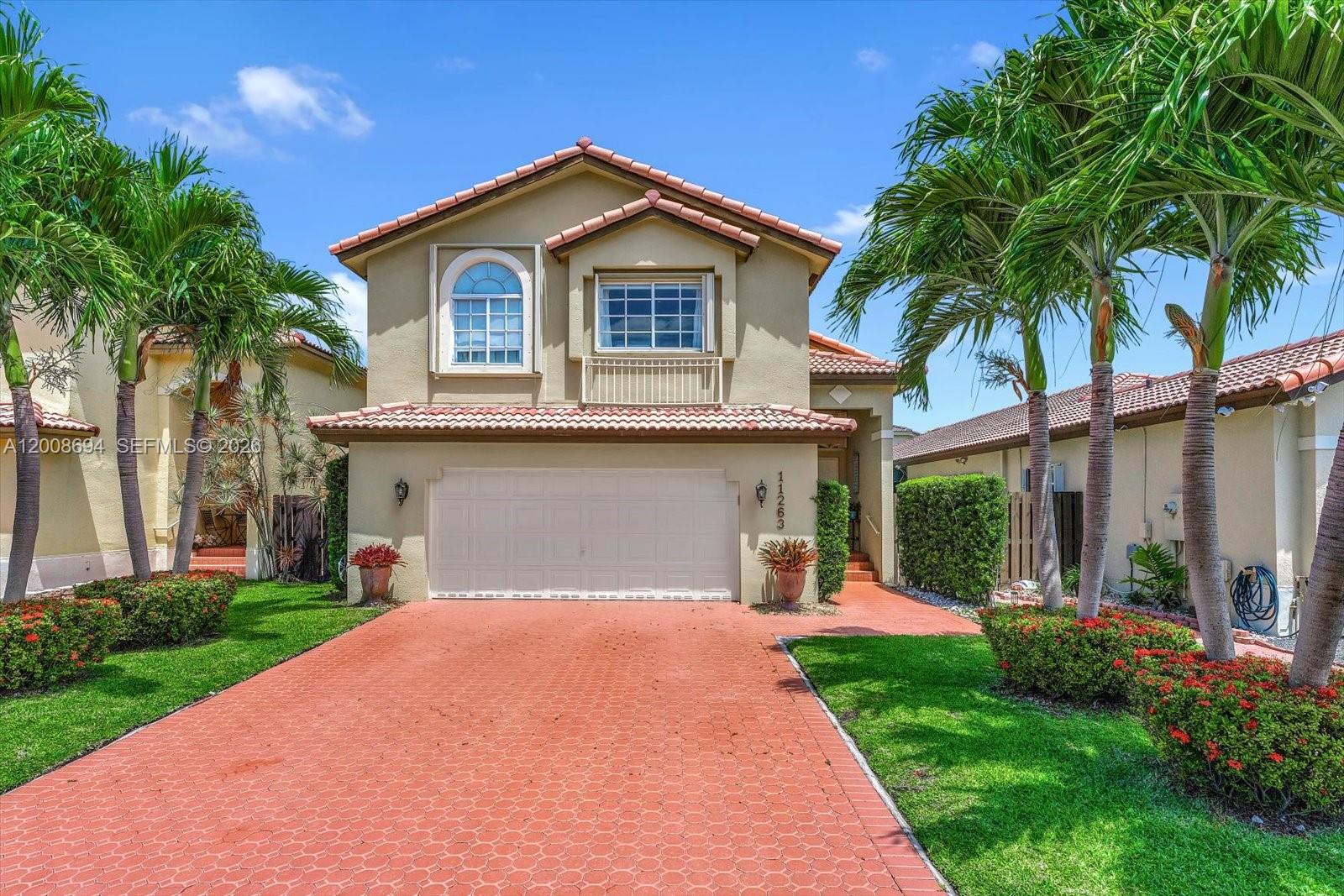 Beautiful remodeled 4-bedroom, 2.5-bath home located in one of Dora's best gated communities. This residence features  a double-door entry, high ceilings, creating a bright and spacious feel throughout. The first floor offers elegant marble floor throughout and a beautiful kitchen with quartz countertop. The second floor showcases warm wood floors, very large primary suite with walk in closets and bathrooms with granite countertop. Enjoy upgraded railing details and French doors that enhance the living area with natural light and charm. The home is move-in ready with custom closets, new washer and dryer, new A/C, and new dishwasher. Additional features include accordion shutters for peace of mind and a 2-car garage. Enjoy a generous size backyard with grassy area. Community offers pool, playground, guest parking, 24 hrs security, and internet/alarm included. Low HOA, gated community.