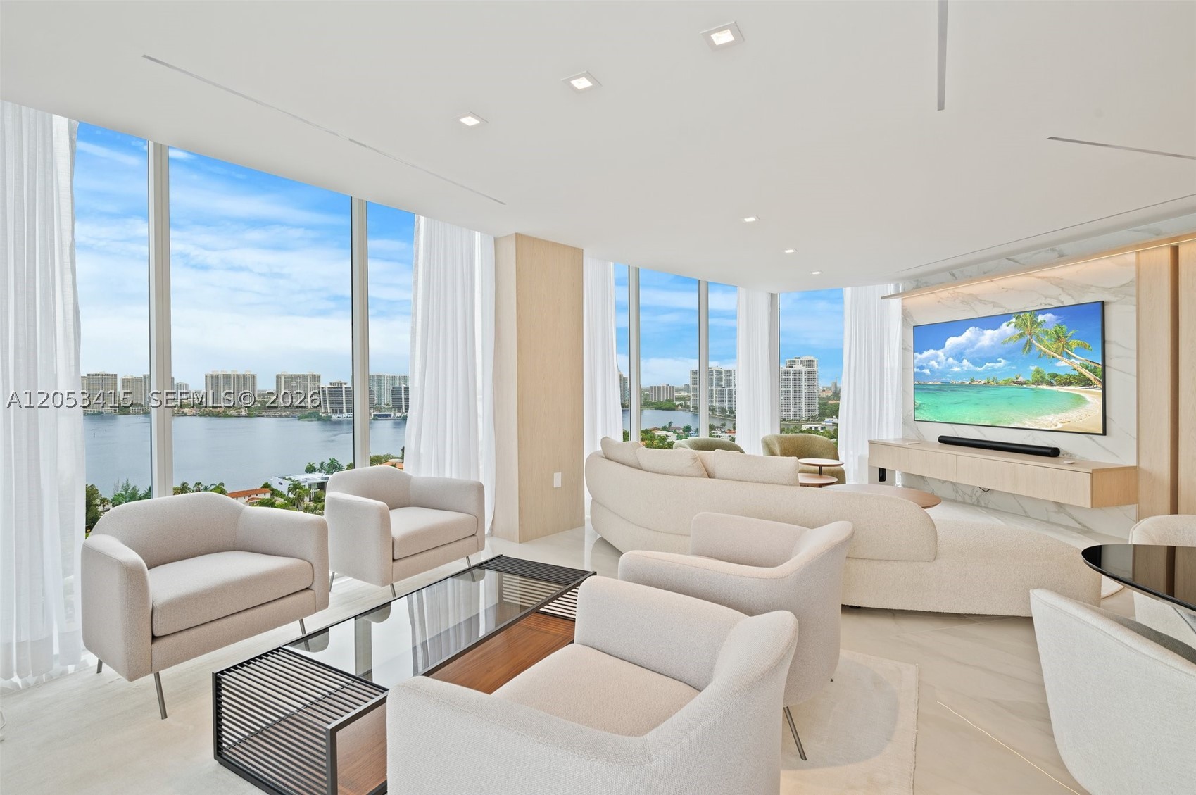 Experience luxury oceanfront living in this beautifully renovated residence at Millennium Sunny Isles Beach. This high-floor home offers breathtaking direct ocean and Intracoastal views through floor-to-ceiling glass and expansive wraparound terraces.

Thoughtfully redesigned with a sophisticated contemporary aesthetic, the residence features an open-concept layout, custom millwork, designer lighting, premium stone finishes, and a stunning chef's kitchen with custom cabinetry and top-quality appliances. The spacious living and dining areas are surrounded by spectacular water views, creating an ideal setting for both relaxing and entertaining.

Wake up to the sound of the ocean from the elegant primary suite and enjoy resort-style living with private beach access, beach service, oceanfront pool, fitness center, spa, valet, concierge, and 24-hour security.

Offered fully furnished and move-in ready, this exceptional residence delivers the ultimate Sunny Isles Beach lifestyle.