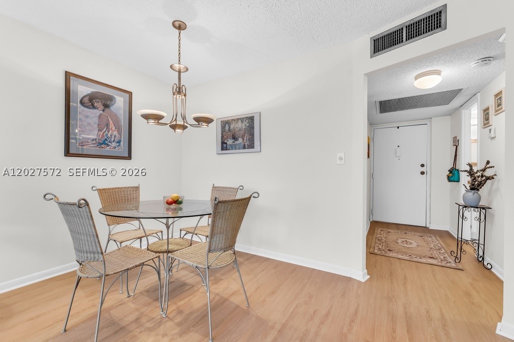 Spacious 1 Bed, 1.5 Bath ALL AGES condo with BRAND NEW LUXURY VINYL flooring & COMPLETE IMPACT WINDOWS throughout! Favorable layout with generous storage, including a walk-in closet, & flex space. FRESHLY PAINTED throughout entire condo. New disposal in kitchen. BRAND NEW vertical blinds throughout. Building already passed 40-year inspection - NO current or upcoming assessments. SUPERIOR LOCATION - next to Publix Plaza with Starbucks, shops, & dining. Minutes to Plantation Walk, shopping, FLL Airport, & major highways. Secure building & lobby, laundry on same floor as unit, includes oversized storage locker, 1 assigned space & guest parking. Amenities include pool, clubhouse, gym, & BBQ area. No leasing first 3 years. Pet restrictions under 20 lbs. Great for full-time or part-time residents alike!