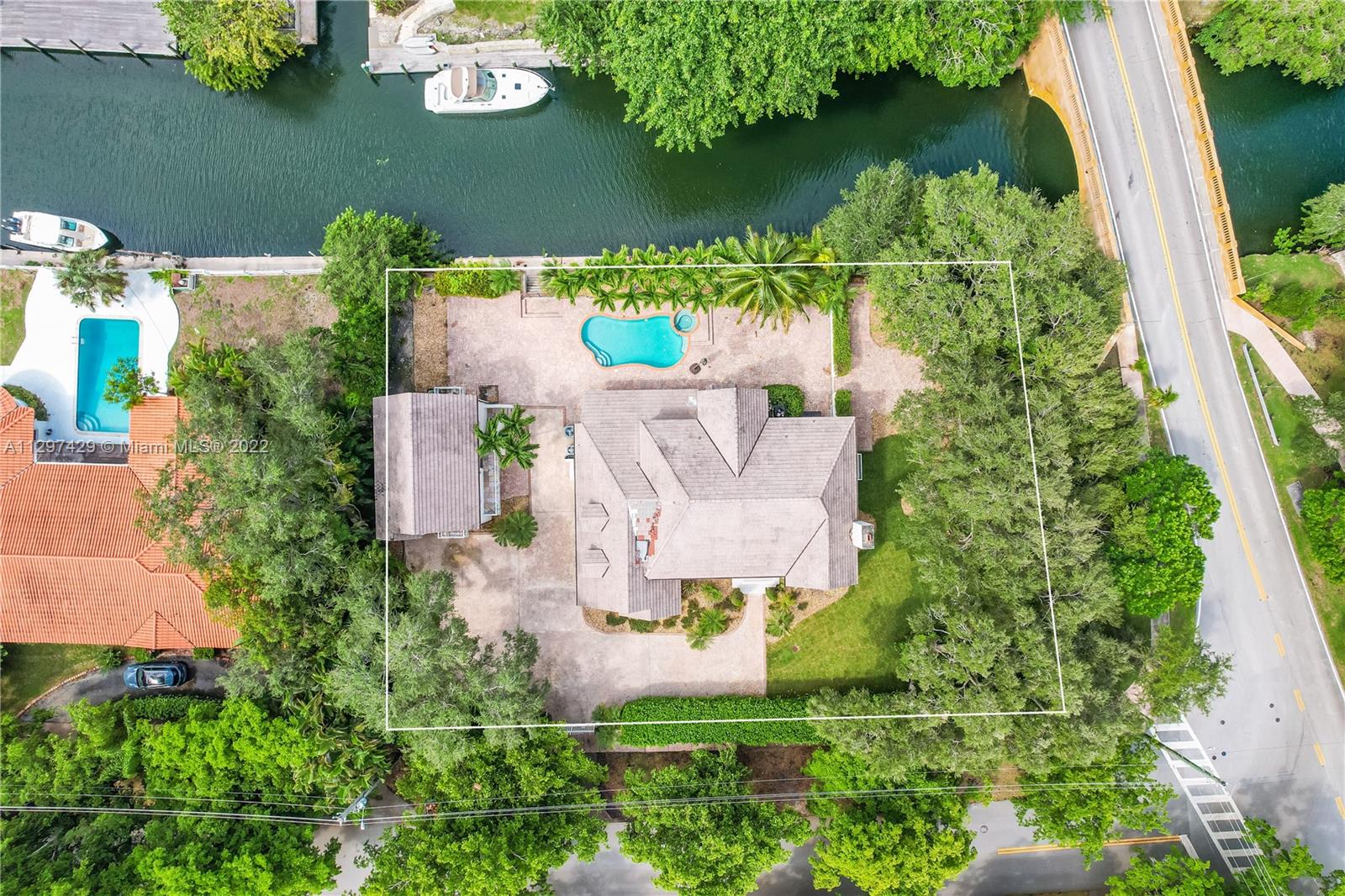 Charming waterfront living in South Gables. This unique two-story home has 4 bedrooms and 3 1/2 baths plus a 1/1 guest cottage that is great for the in-laws. The main house has spacious staging areas, formal dining room, family room and study. Other distinctive features include a working elevator, wine cellar, and gorgeous high windows. Oak tree-filled lot provides beautiful views of nature all around you. Come home to your very own paradise. This is a unique house has a 20,000 square feet lot with lots of potential for several outdoor recreation areas with canal access and waterways that are only 10-15 minutes from Biscayne Bay.