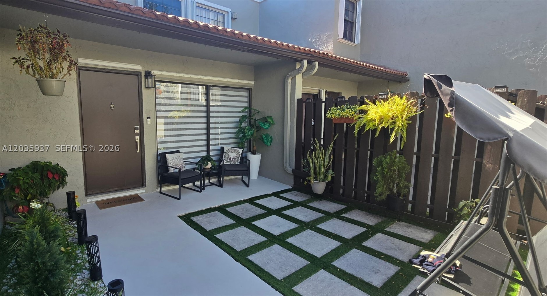 Beautifully renovated two-story townhouse for rent in the desirable Palm Point Community at The Hammocks. This move-in-ready home features 2 bedrooms, 1.5 bathrooms, a private porch, and a terrace. Laminate flooring throughout.The first floor offers a spacious living and dining area, an updated kitchen, a half bath, and access to the terrace. Upstairs, you'll find two  bedrooms connected by a full bathroom.The property includes one assigned parking space plus ample guest parking. Residents enjoy access to The Hammocks' exceptional amenities, including clubhouses, swimming pools, scenic walking and biking trails, fitness stations, interconnected lakes, and beautifully maintained green spaces. Conveniently located near top-rated schools, shopping centers, restaurants, Walmart, Baptist Hospital West, and major roadways.Easy to show! Don't miss this opportunity, this one won't last!