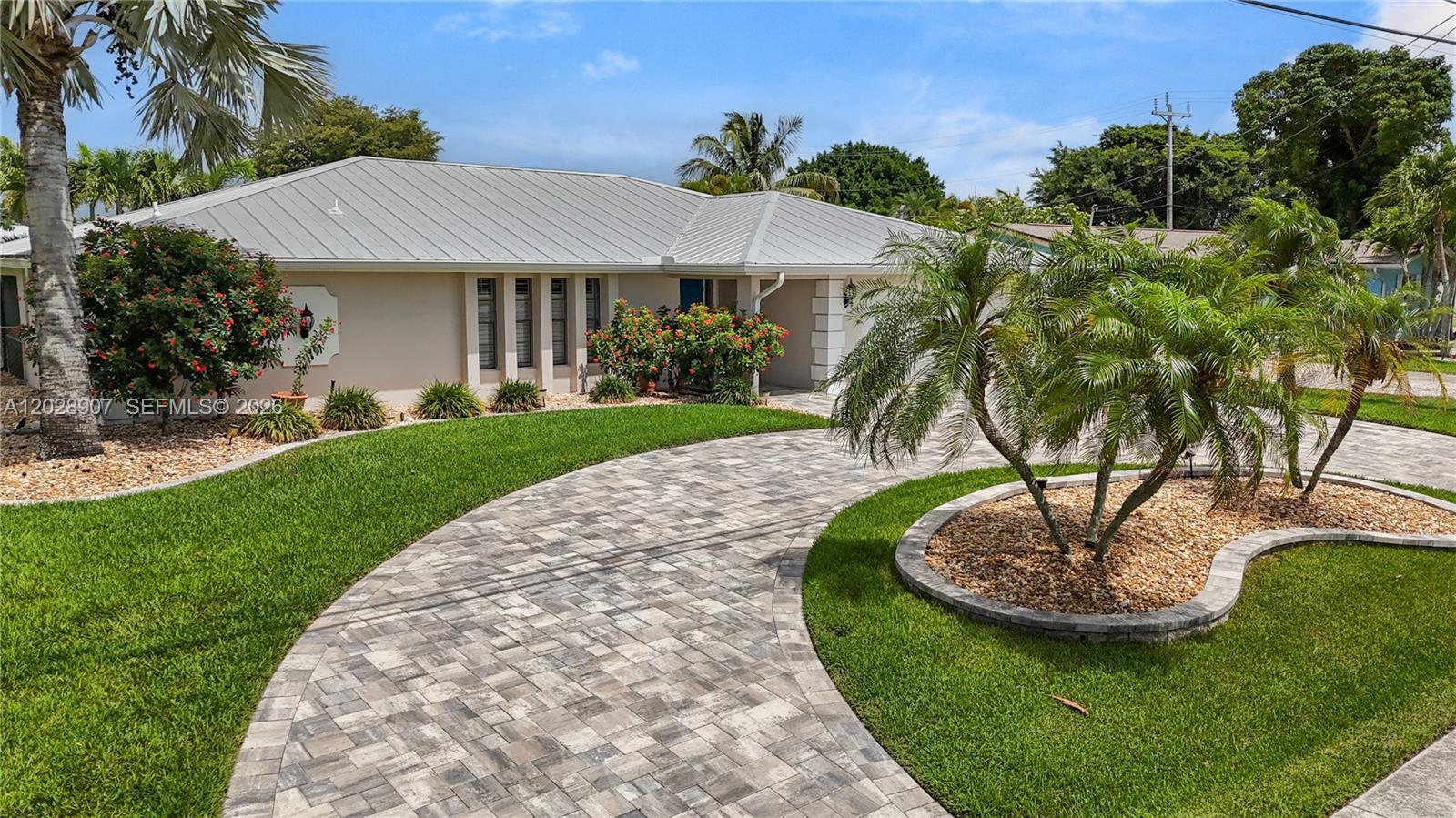 Turnkey furnished 4 bedroom, 2.5 bath pool home with direct Gulf access and a highly desirable Southwest Cape Coral location. The outdoor living area is designed for enjoying the waterfront lifestyle with a resurfaced saltwater pool and sunshelf completed in 2023, electric heat, composite dock with captain’s walk around, 10,000 lb boat lift and tiki hut. The fully fenced yard adds privacy while the canal views create a relaxing setting throughout the property. Inside, the spacious island kitchen features wood shaker cabinets, ample counter space, bar seating for 8, a pot filler and pass through impact window to the lanai. The large primary suite offers sliding glass doors to the pool area with views of the canal and a beautifully renovated en suite bath with a freestanding soaking tub, oversized walk in shower and large vanity. Two spacious guest bedrooms are located toward the back of the home and share a large bath that also functions as a pool bath. The fourth bedroom sits just off the kitchen with French doors and works perfectly as a home office, gym, playroom or additional guest space. A half bath and interior laundry room add convenience and functionality. Located within walking distance to Rotary Park and nature trails and just a short bike ride to Tarpon Point Marina with waterfront dining, shopping and entertainment, this property also places you minutes from everyday conveniences while offering the best of Southwest Florida living.