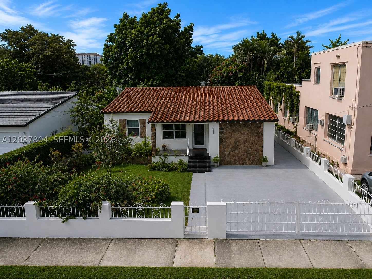 Charming 3 bedroom 2 bathroom home located in the highly desirable Little Gables area, a residence offering modern finishes, functional living space, and incredible versatility. This move-in-ready home showcases a bright open floor plan with oversized porcelain tile flooring throughout, a modern kitchen, quartz countertops, stainless steel appliances, updated bathrooms and impact windows. The exterior has excellent curb appeal with a classic barrel tile roof, fresh landscaping, and a spacious driveway with ample parking. The big backyard offers endless possibilities for entertaining & outdoor activities. Conveniently located just minutes from Coral Gables, Downtown Miami, Miami International Airport, major highways, shopping, dining, and entertainment. This home is a great opportunity for first time home buyer as well as investors.