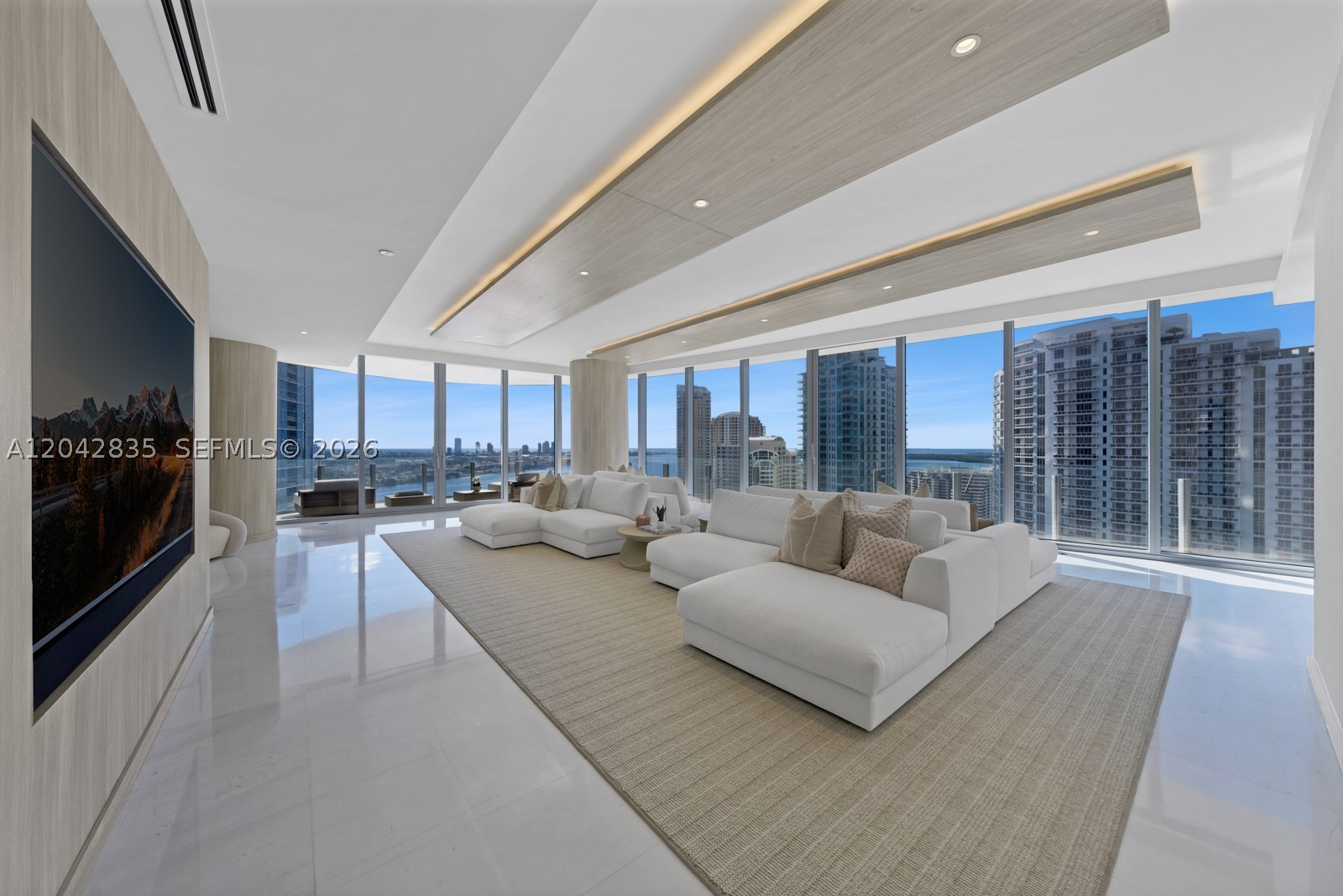Step Inside With Me! Thoughtfully curated and impeccably upgraded, this stunning corner residence at the iconic Aston Martin Residences offers 5 beds, 5.5 baths & over 3,900sf of refined interiors & panoramic views of Biscayne Bay. Furnished by luxury designer Steven G., the social areas, primary suite, & a guest bedroom are elegantly appointed. This brand new space features custom closets & cabinetry, a 98” TV w/ sound bar in the great room and a concealed 65” TV in the primary suite with Nexus system. Smart home automation with Savant, automatic shades, and a private elevator foyer add to the comfort and convenience of this home. Residents enjoy over 42,000 sq. ft. of unmatched amenities including an infinity pool, spa, fitness center, curated art gallery, marina, helicopter pad & more.