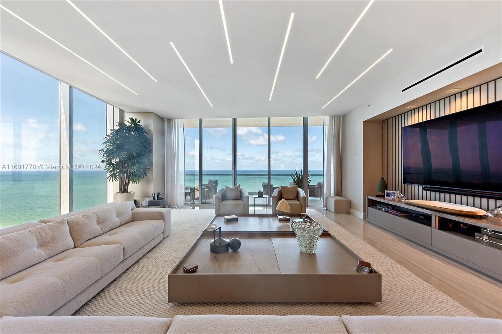 TURN-KEY FORMER DEVELOPER MODEL at the exclusive Turnberry Ocean Club. Luxury oceanfront flow-through corner residence offered complete turn-key furnished and professionally designed. Breathtaking views of the ocean and intracoastal to enjoy sunrise and sunset.  Desirable middle floor, perfectly situated at the right height for privacy and views. 4 spacious bedrooms plus den/staff room, with private elevator lobby. 70,000 sq ft of amenities, including a spectacular sky club, private restaurants, luxurious spa, entertainment rooms, infinity pools and much more.  Enjoy unparalleled service and a fantastic lifestyle for the entire family. Come fall in love.